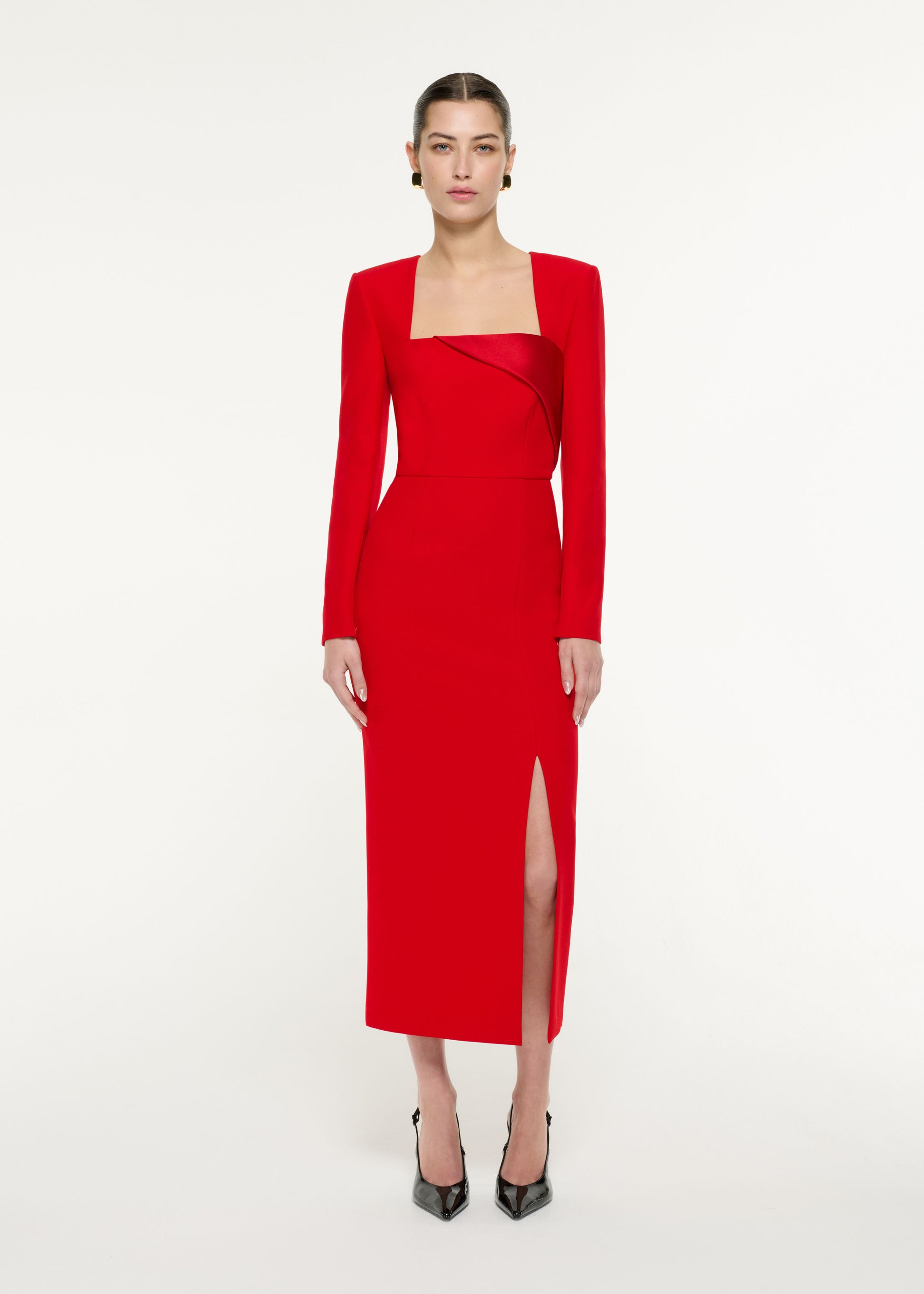 Front view of a model wearing the Diagonal Panel Midi Dress in Red