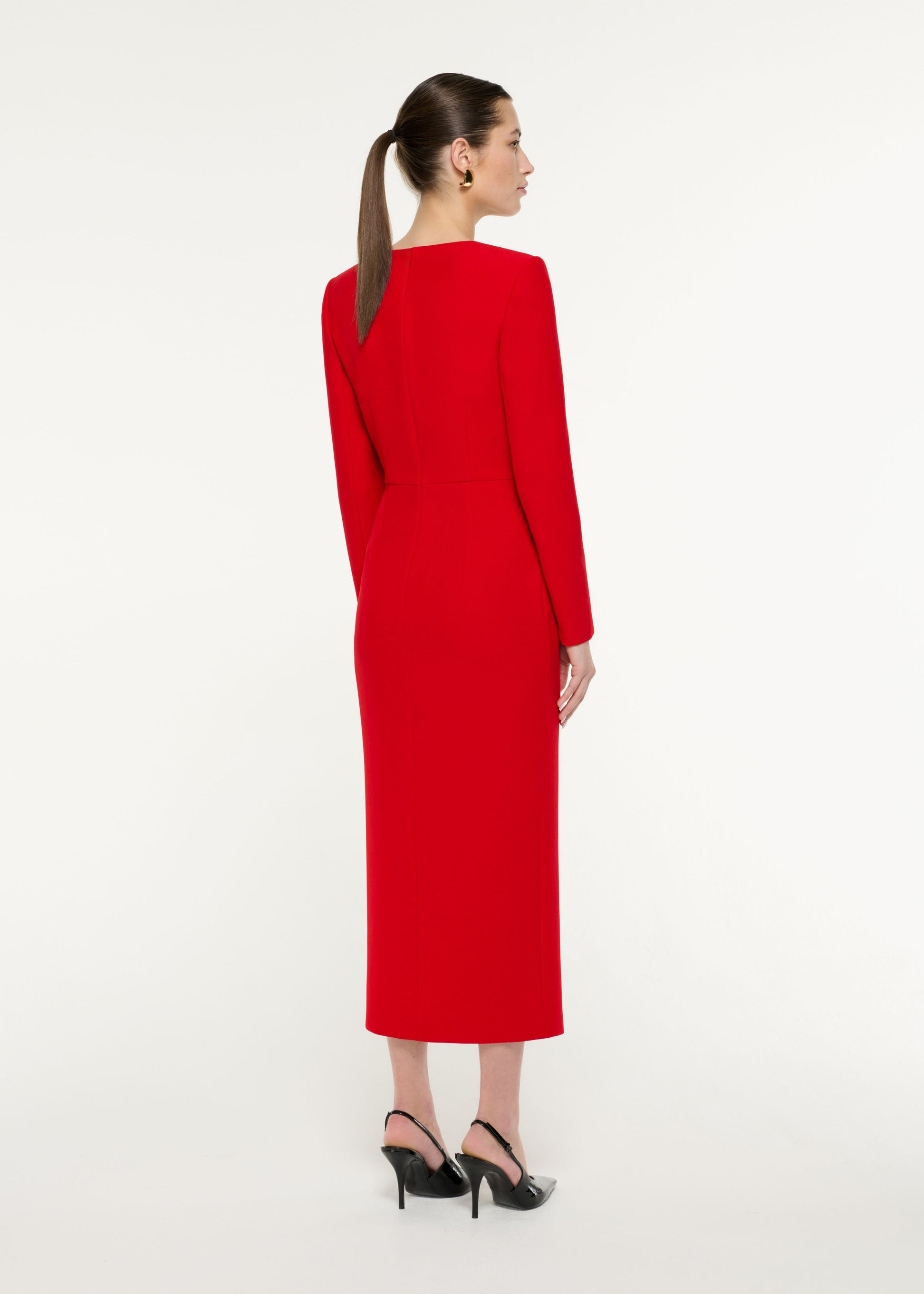Back view of a model wearing the Diagonal Panel Midi Dress in Red