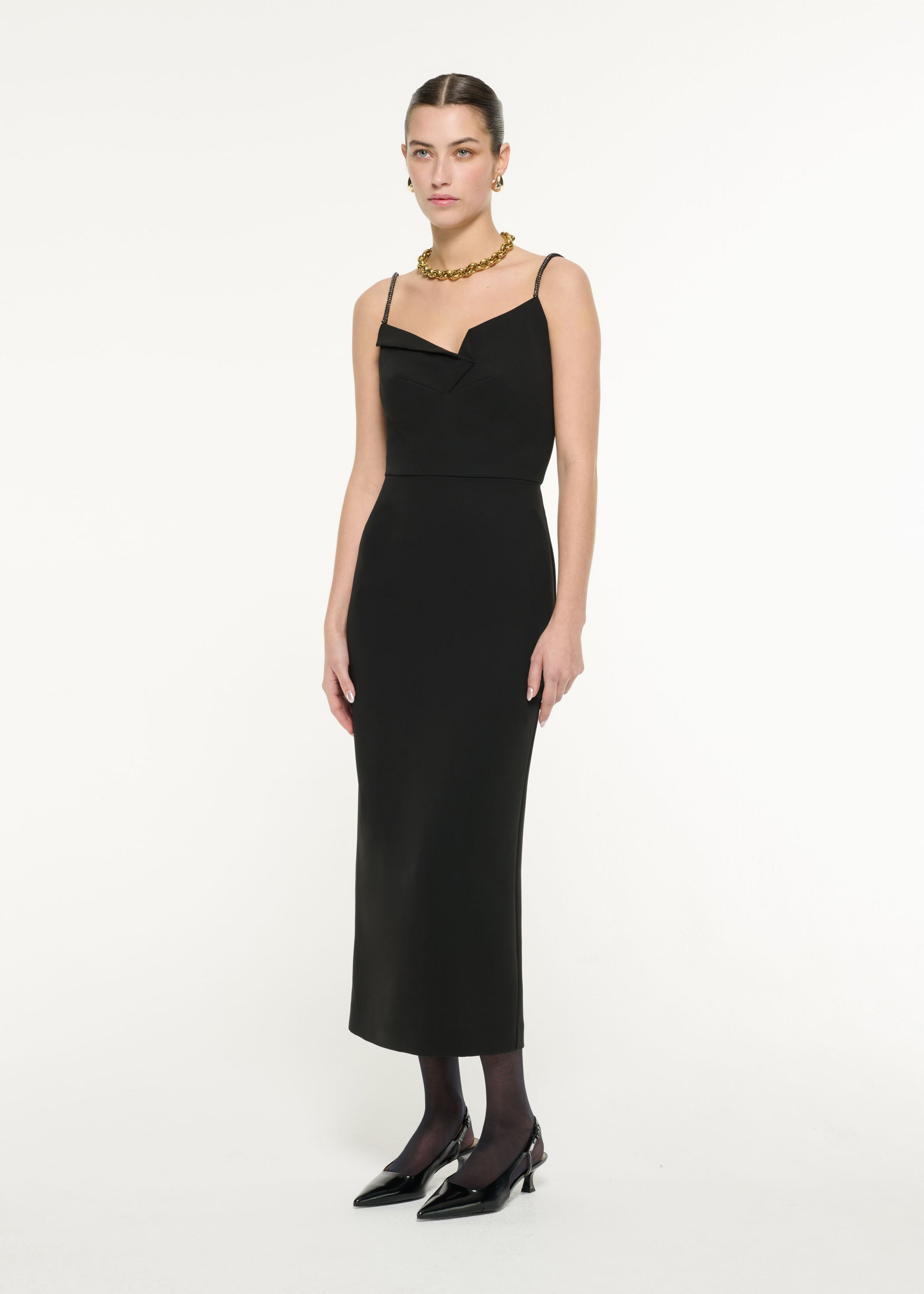Side view of a model wearing the Diamante Strap Crepe Midi Dress in Black