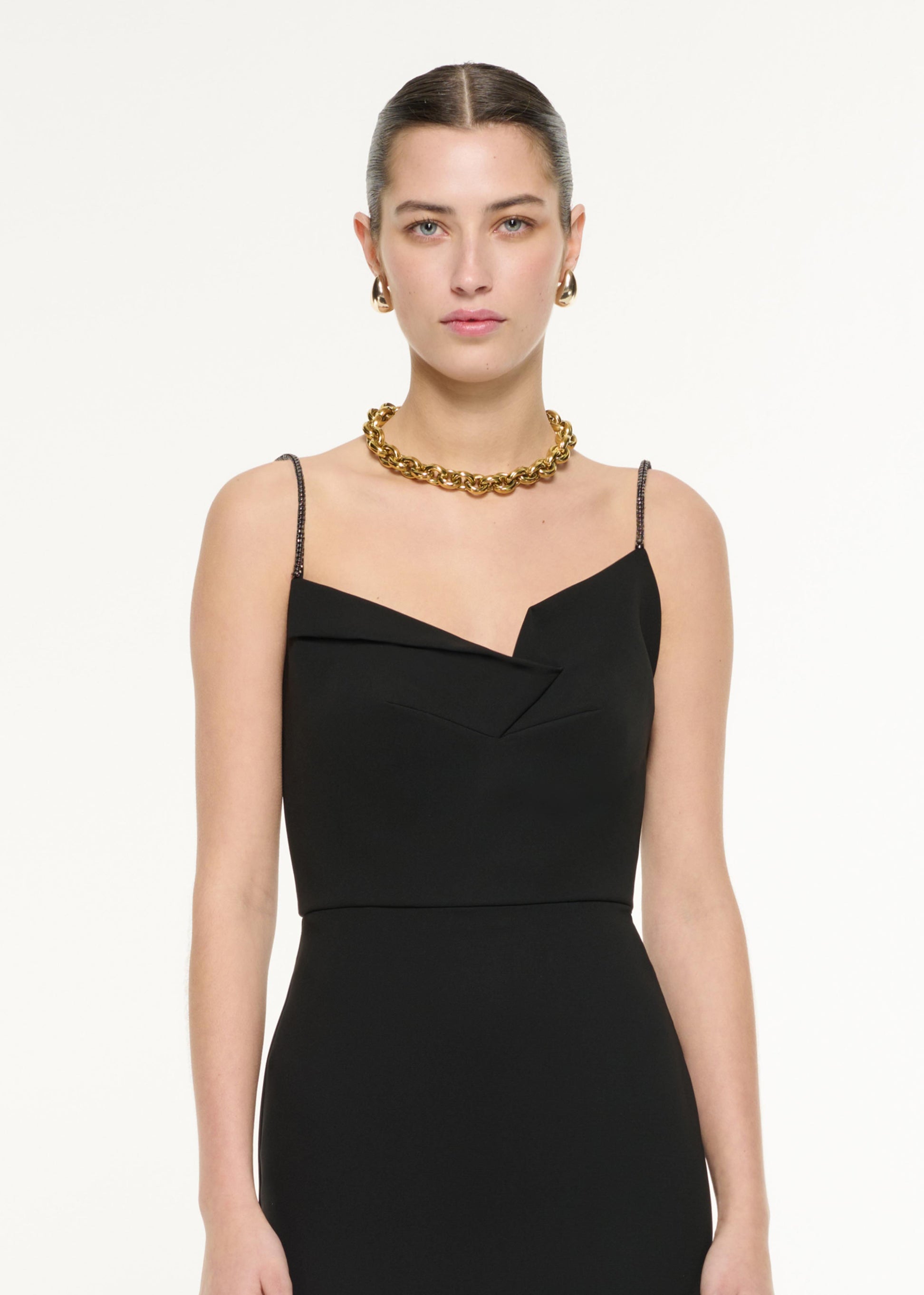 Close up of a model wearing the Diamante Strap Crepe Midi Dress in Black