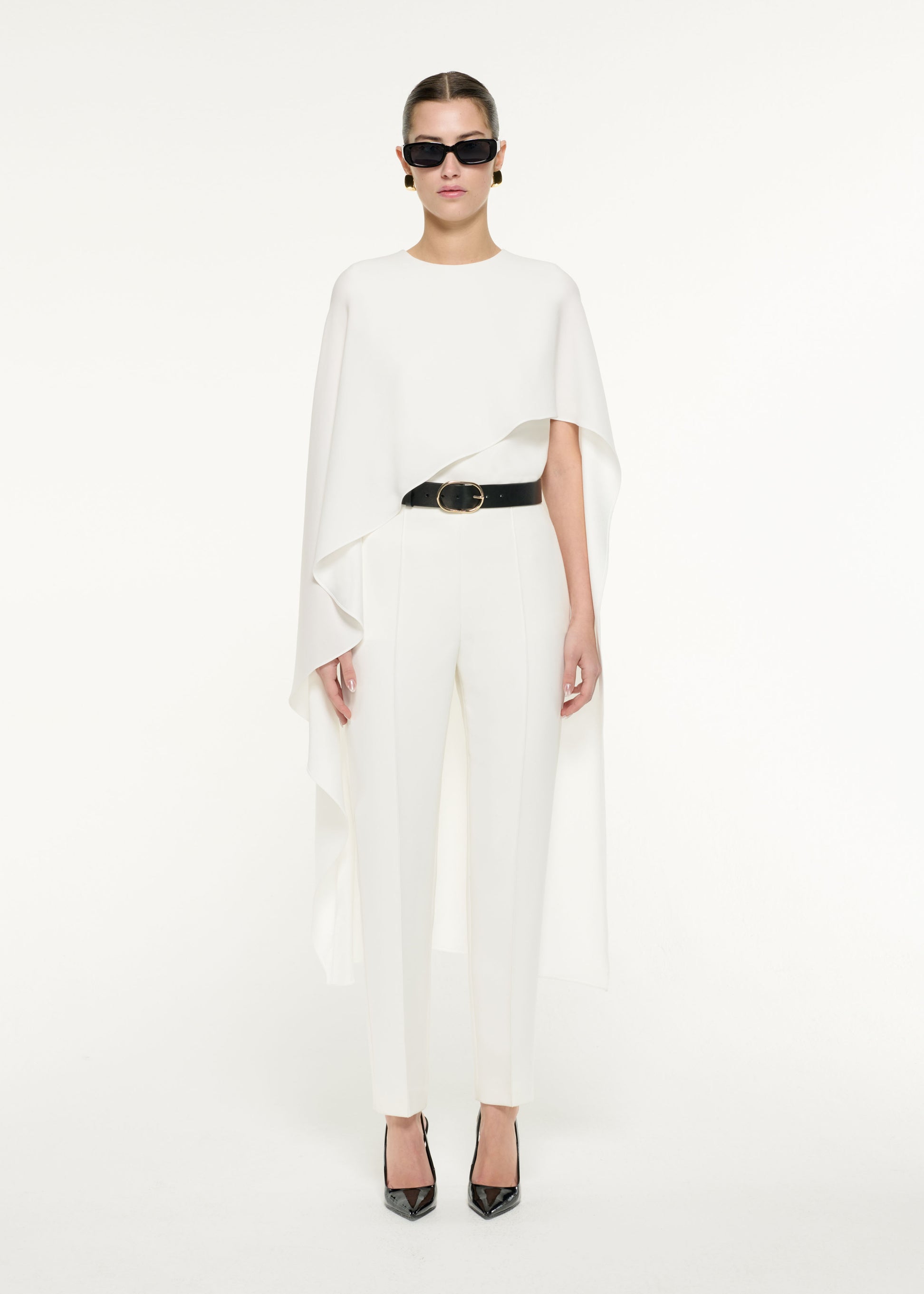 Front view of a model wearing the Satin Crepe Cape Top in White