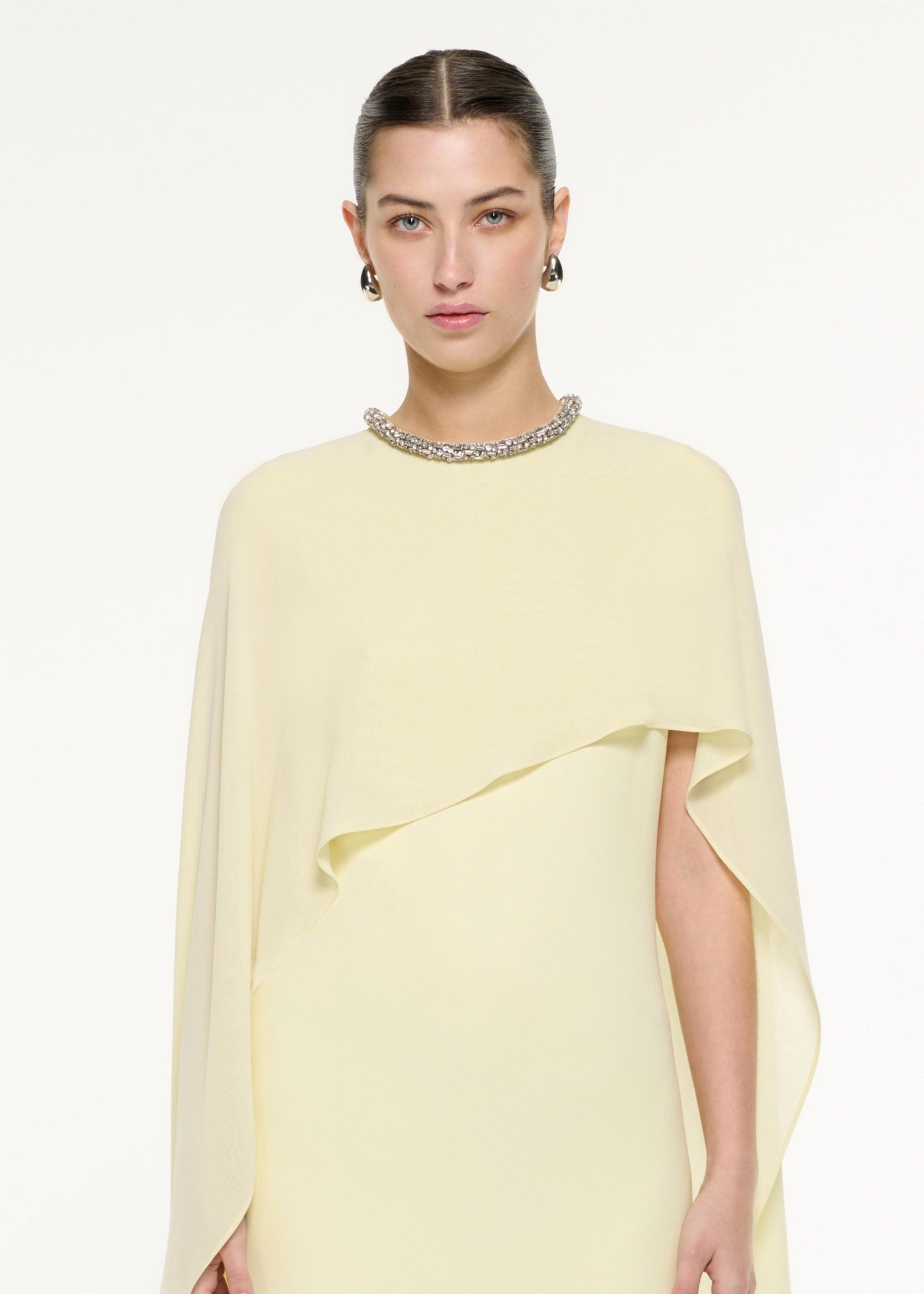 Close up of a model wearing the Silk Cape Maxi Dress in Light Yellow