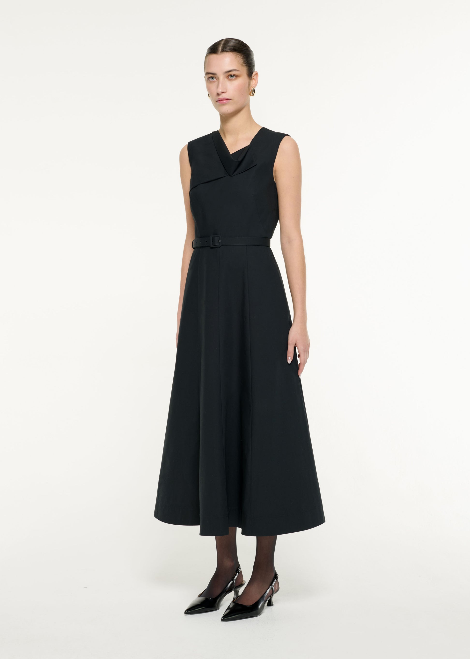 Side view of a model wearing the Drape Cotton Poplin Midi Dress in Black