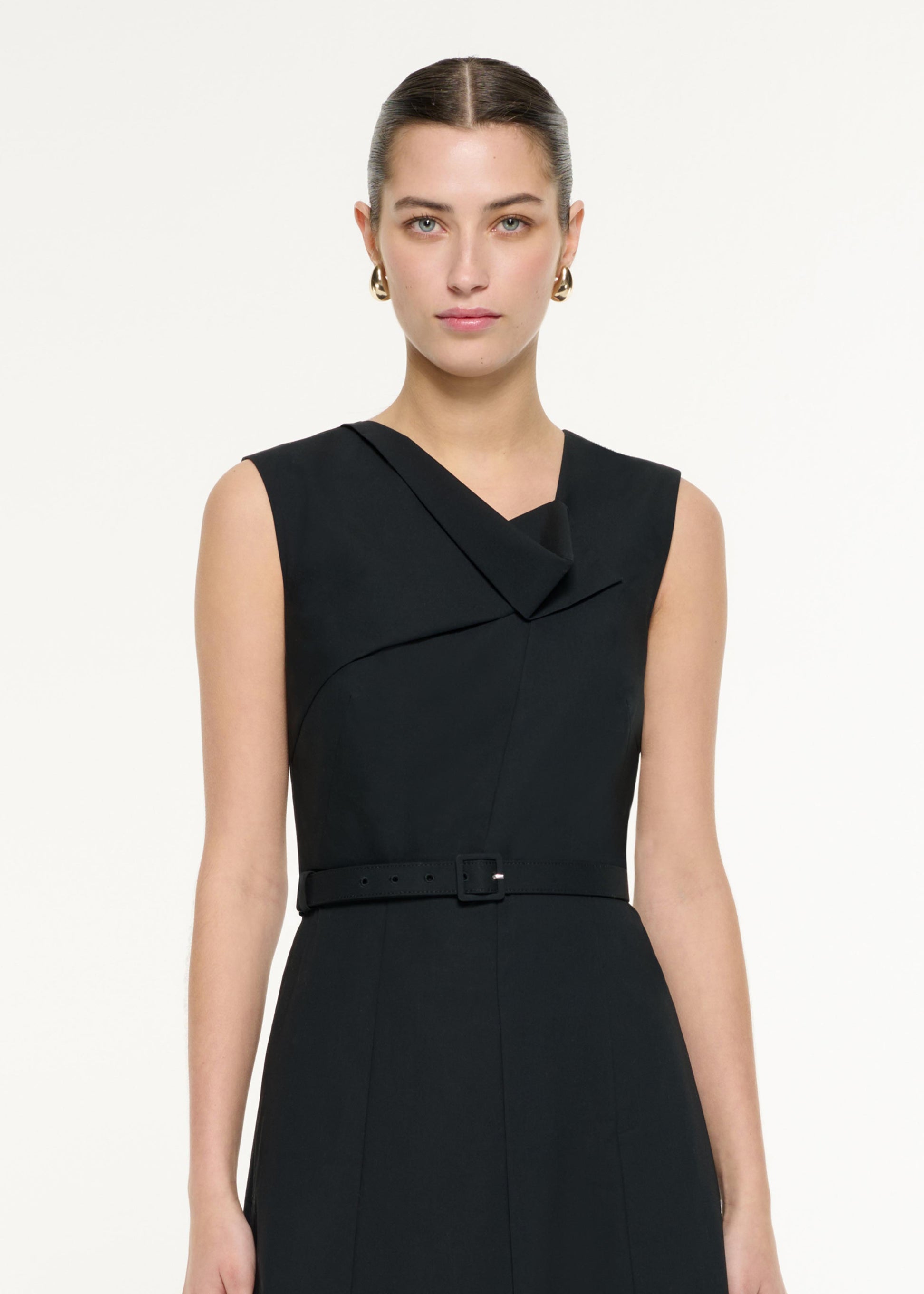 Close up of a model wearing the Drape Cotton Poplin Midi Dress in Black