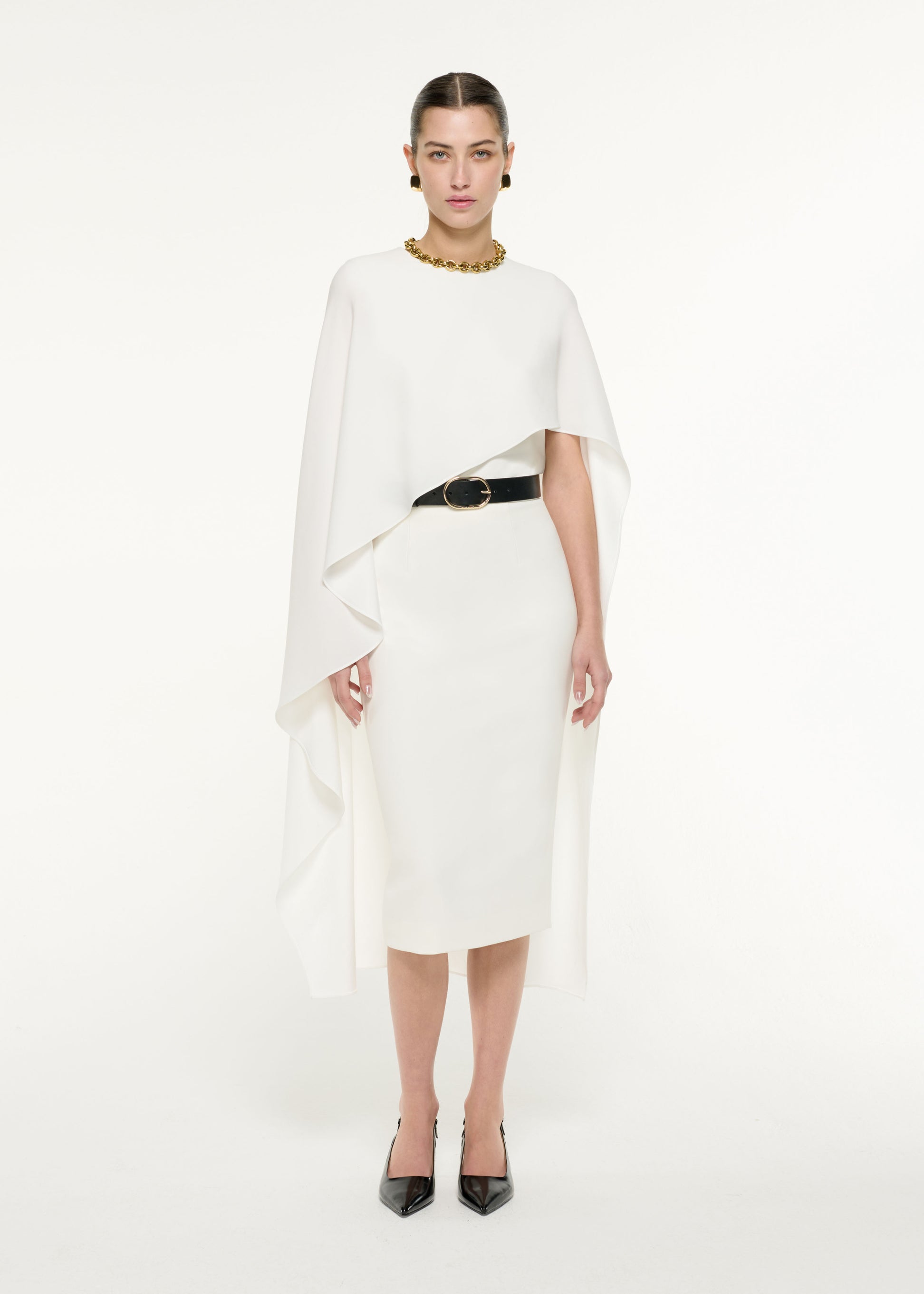 Front view of a model wearing the Pencil Midi Skirt in Cream