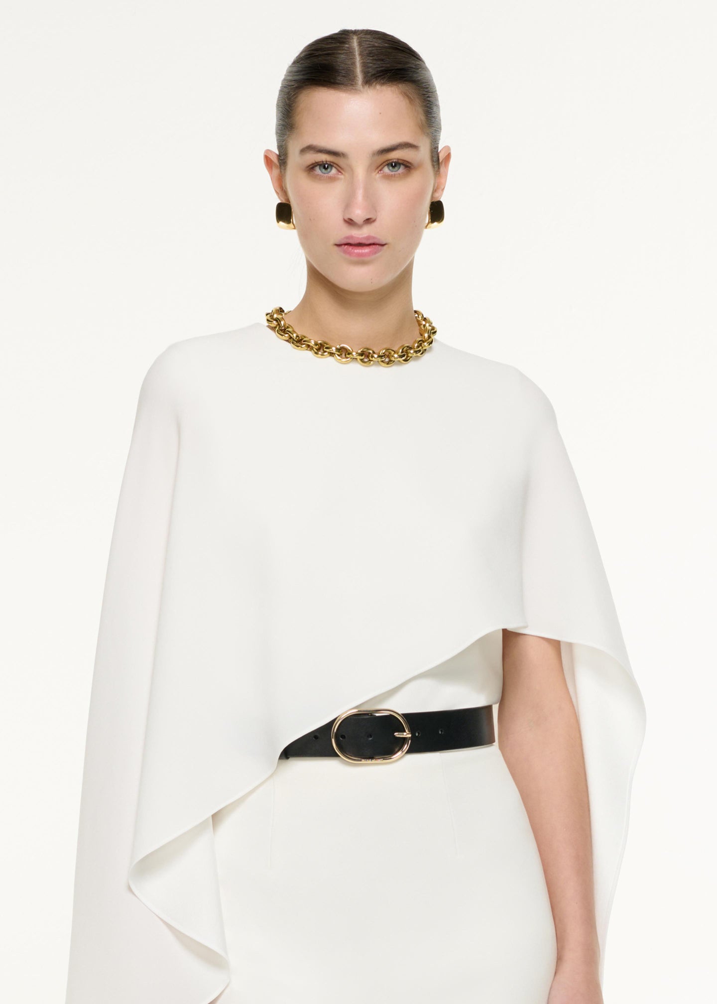 Close up of a model wearing the Pencil Midi Skirt in Cream