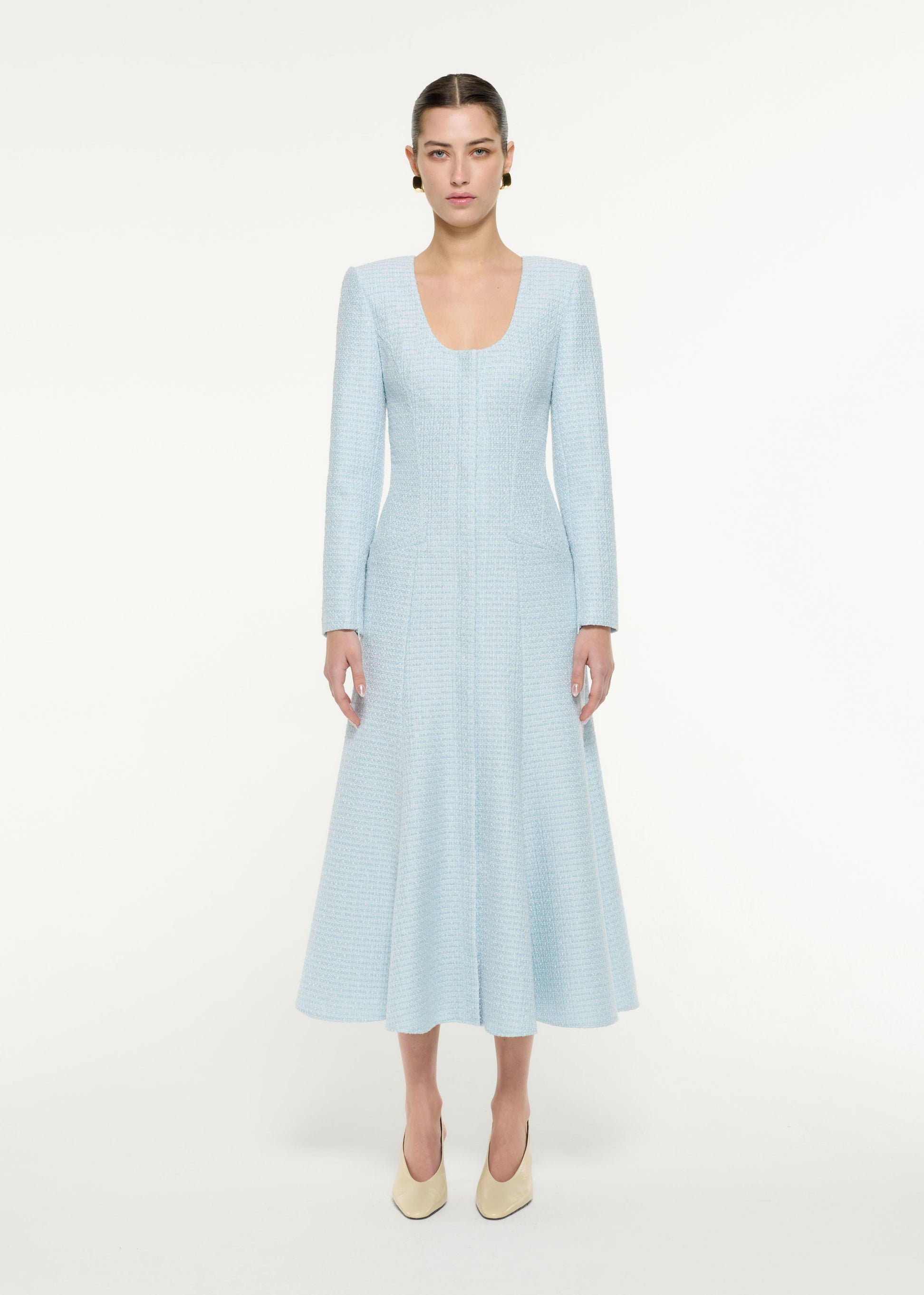 Front view of a model wearing the Boucle Midi Dress in blue