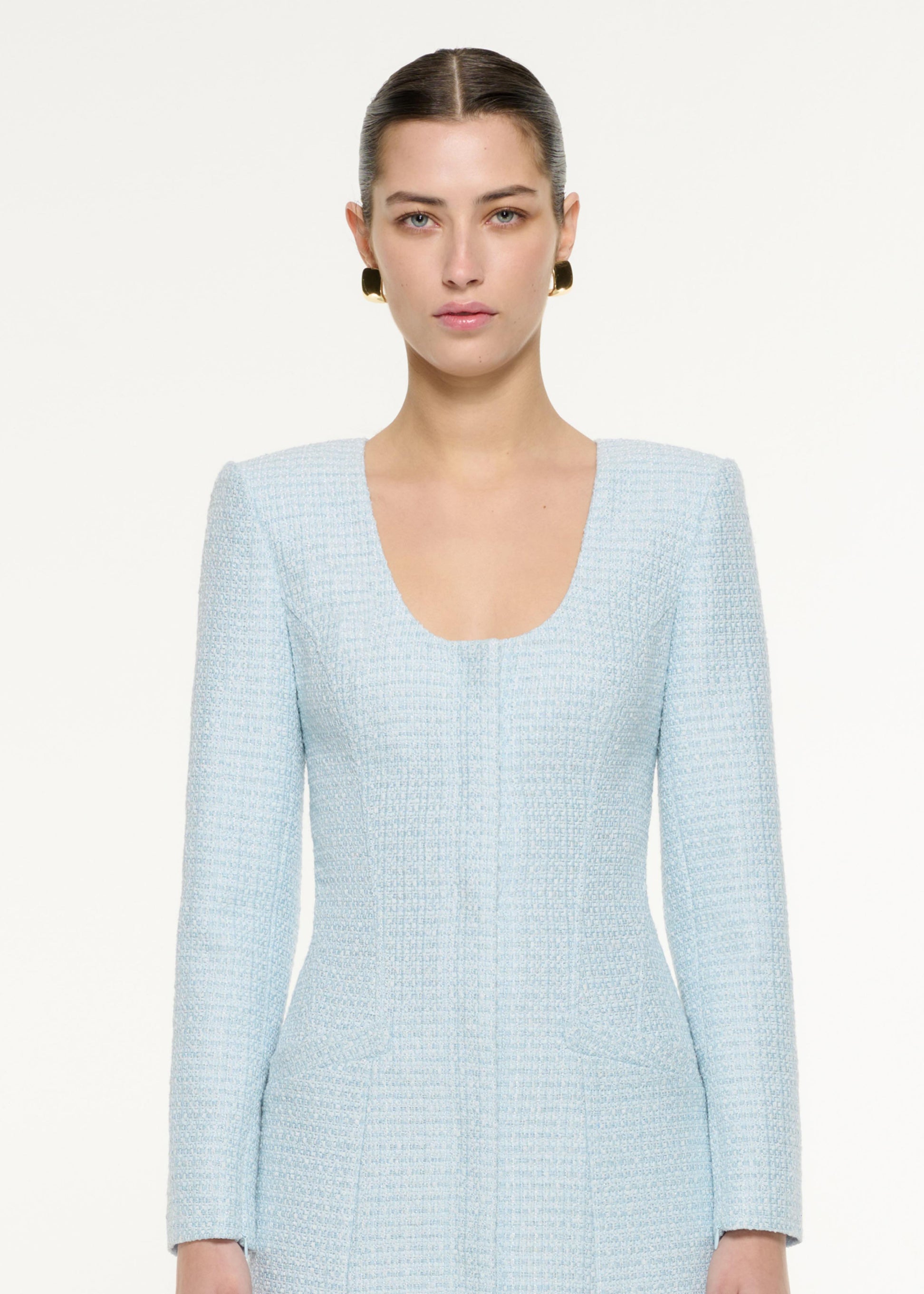 Close up of a model wearing the Boucle Midi Dress in blue