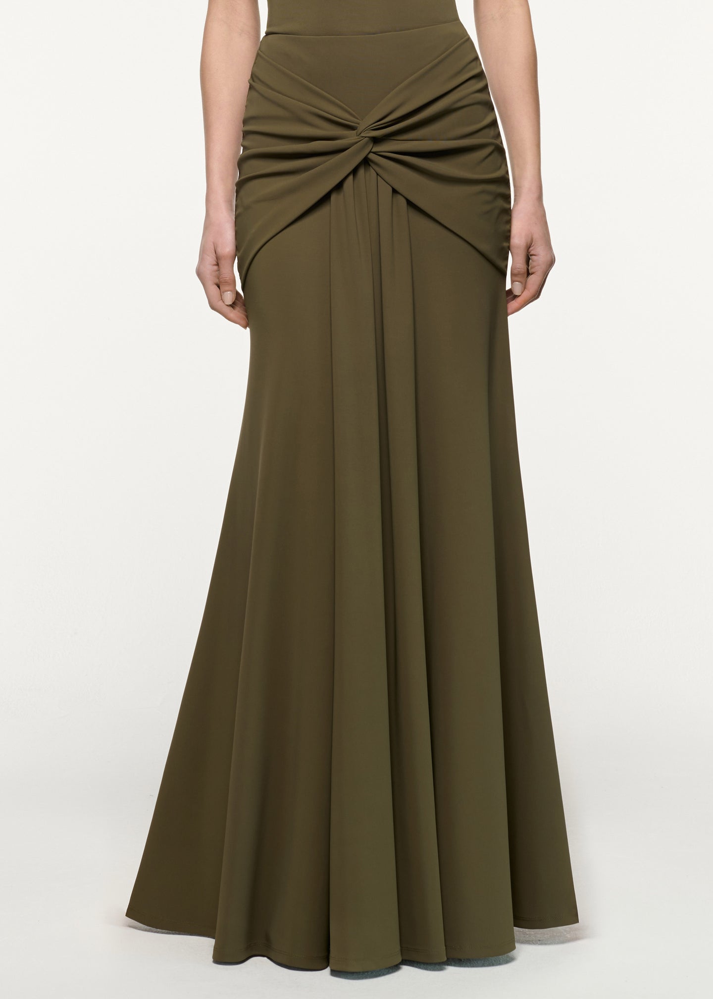 Close up of a model wearing the Waterfall Twist Drape Jersey Skirt in Khaki