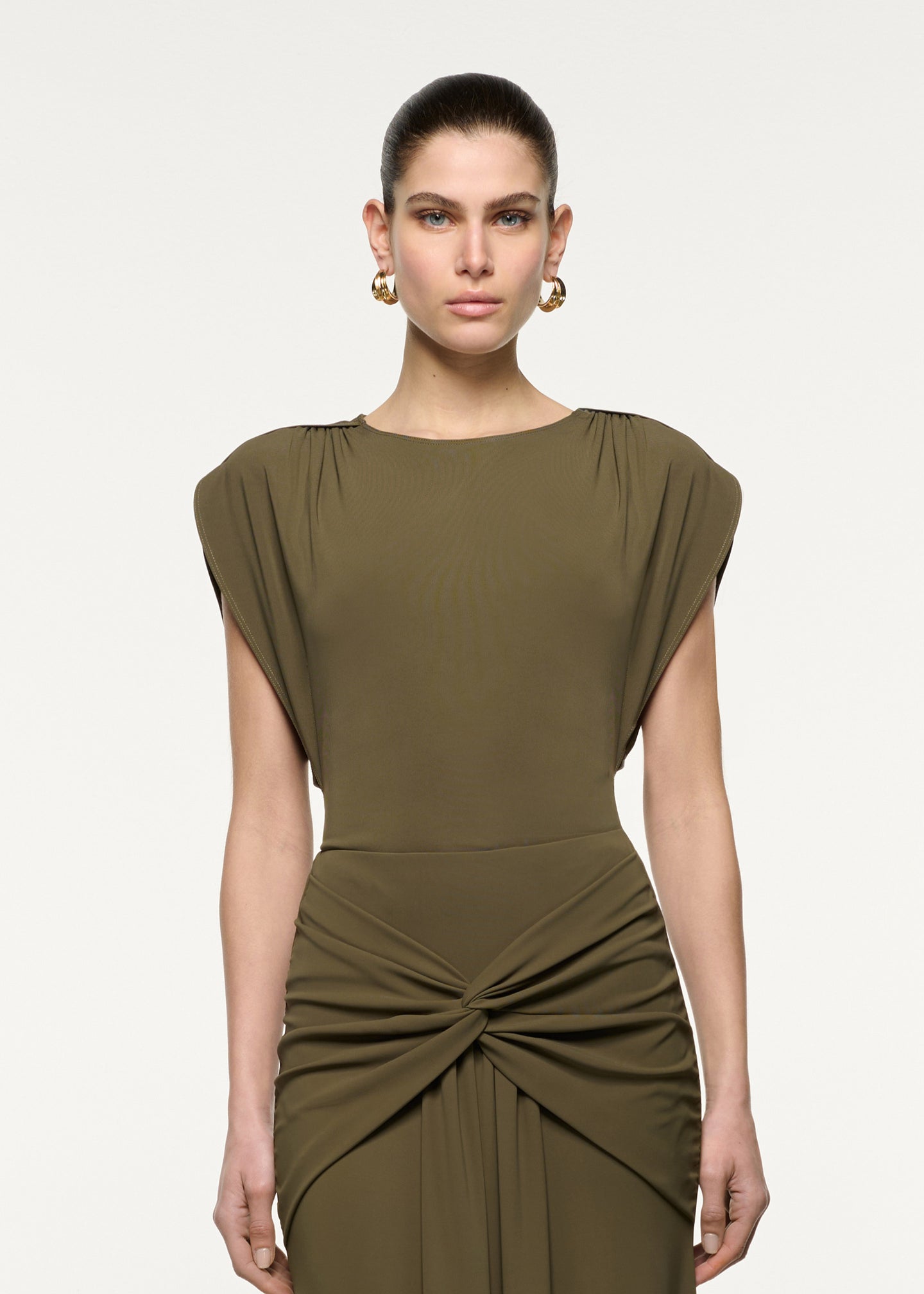 Close up of a model wearing the Petal Drape Sleeve Jersey Top in Khaki
