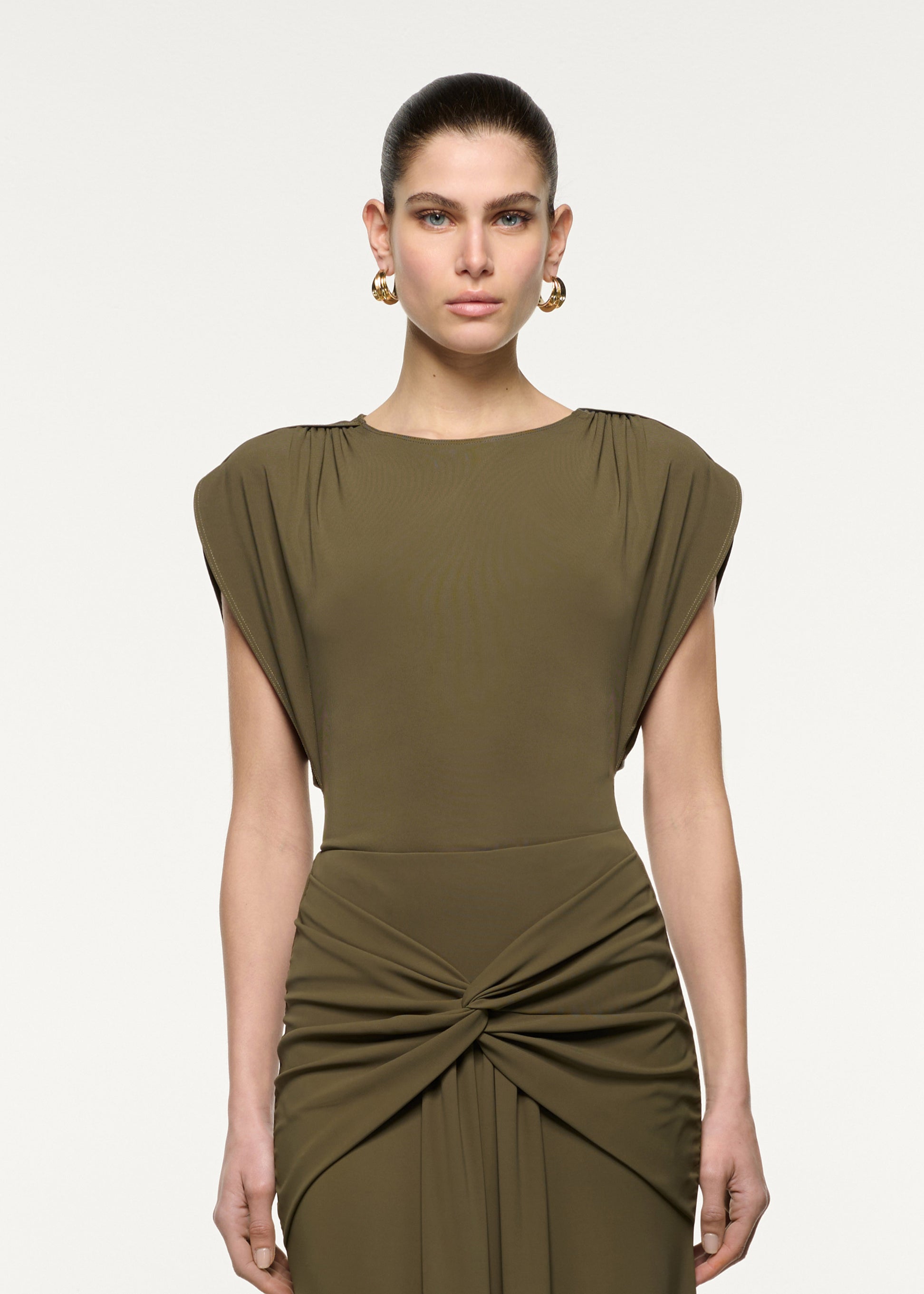 Close up of a model wearing the Petal Drape Sleeve Jersey Top in Khaki
