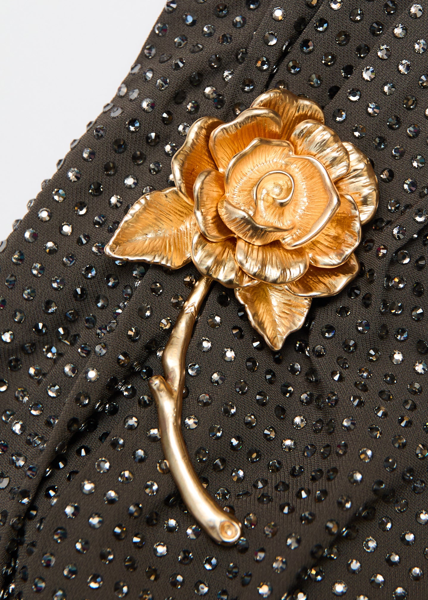 A close up of the fabric for the Gold Rose Brooched Diamante Midi Dress in Taupe