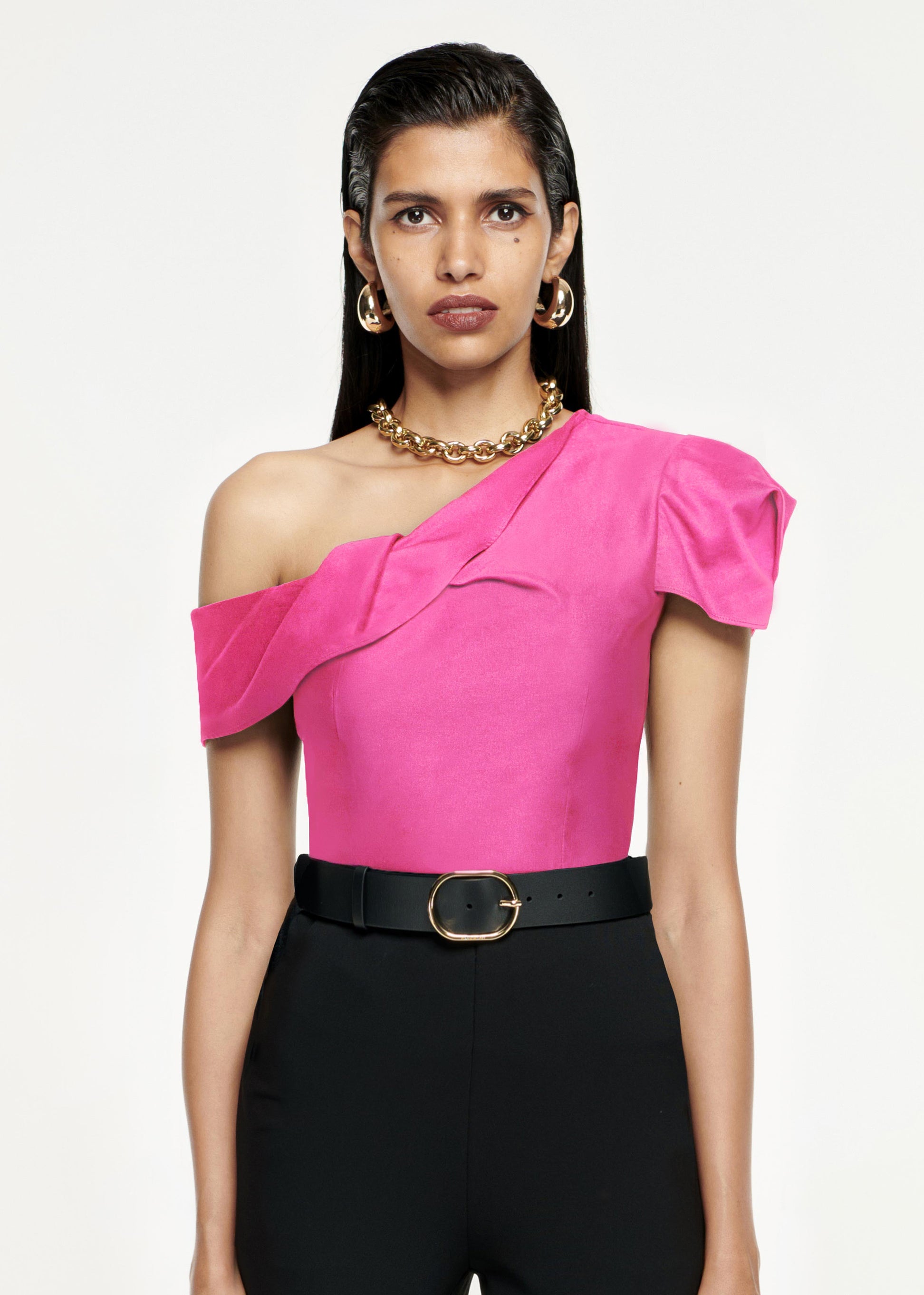 Close up of a model wearing the Asymmetric Stretch-Cady Top in Pink