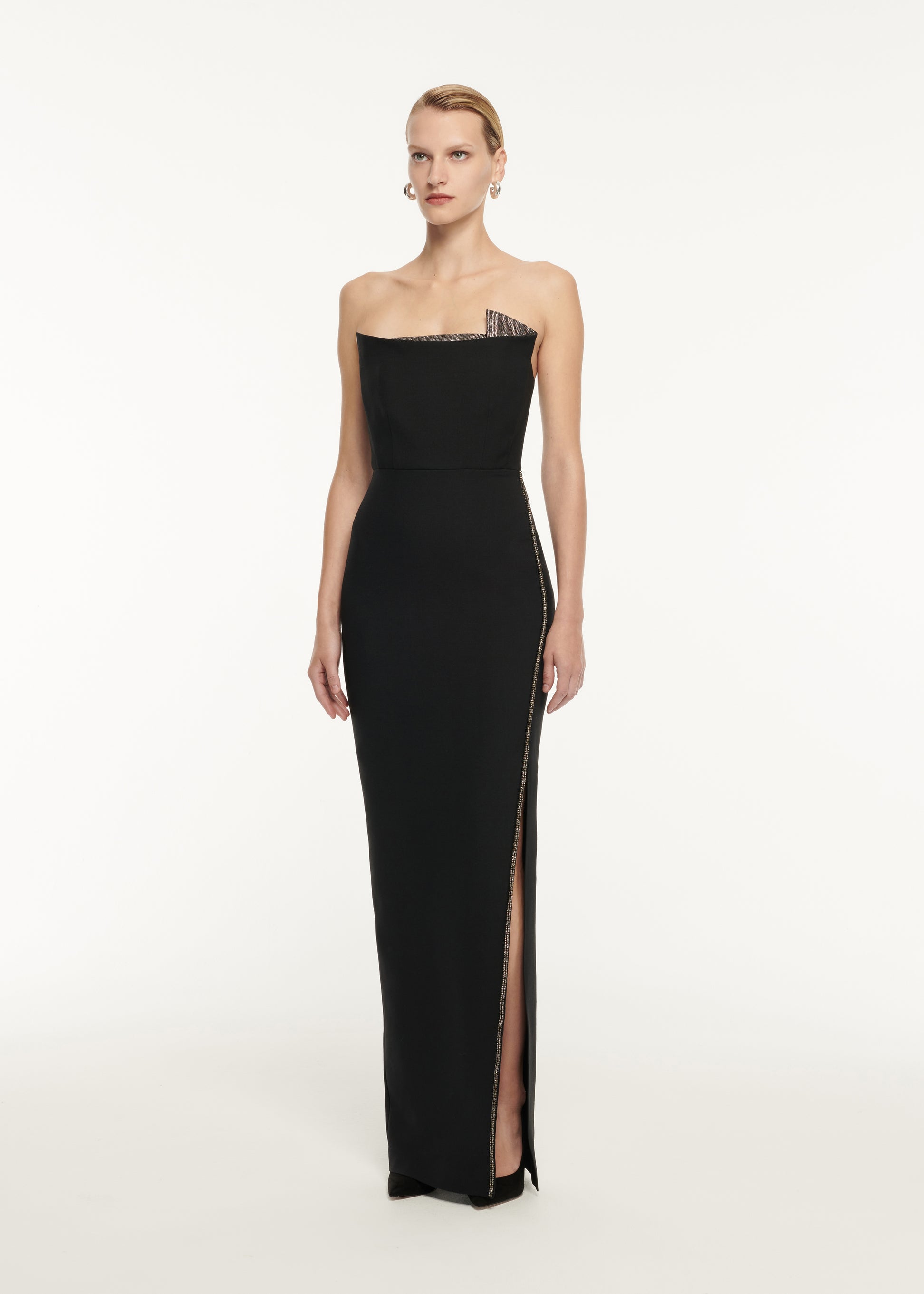 A woman wearing the Strapless Wool Silk Embellished Maxi Dress