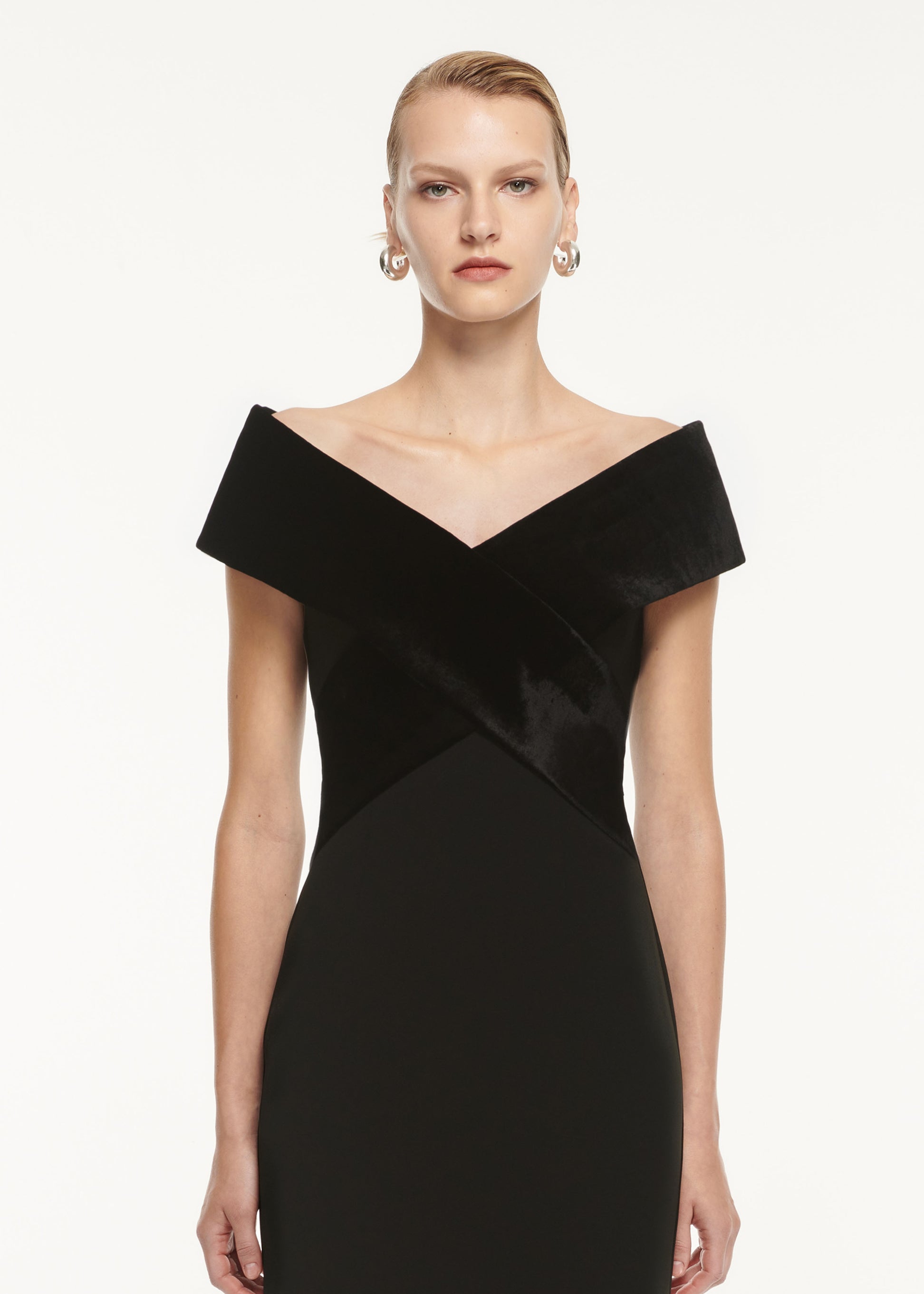 A close up of a woman wearing the Off The Shoulder Stretch Cady Maxi Dress Black