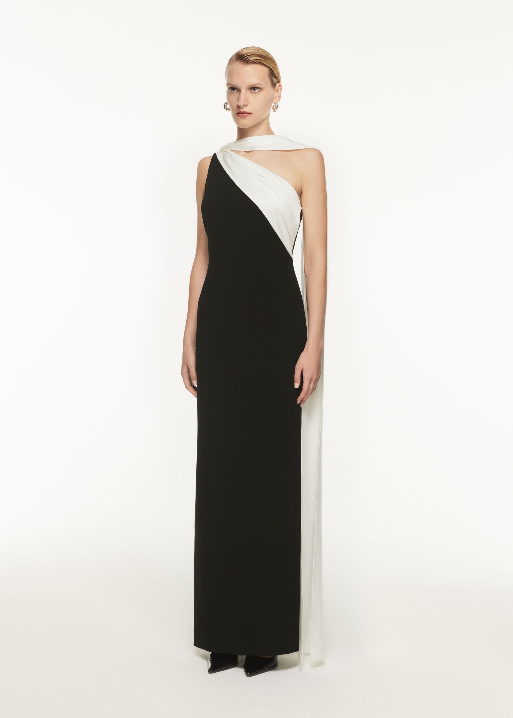 A woman wearing the Asymmetric Satin Sash Maxi Dress