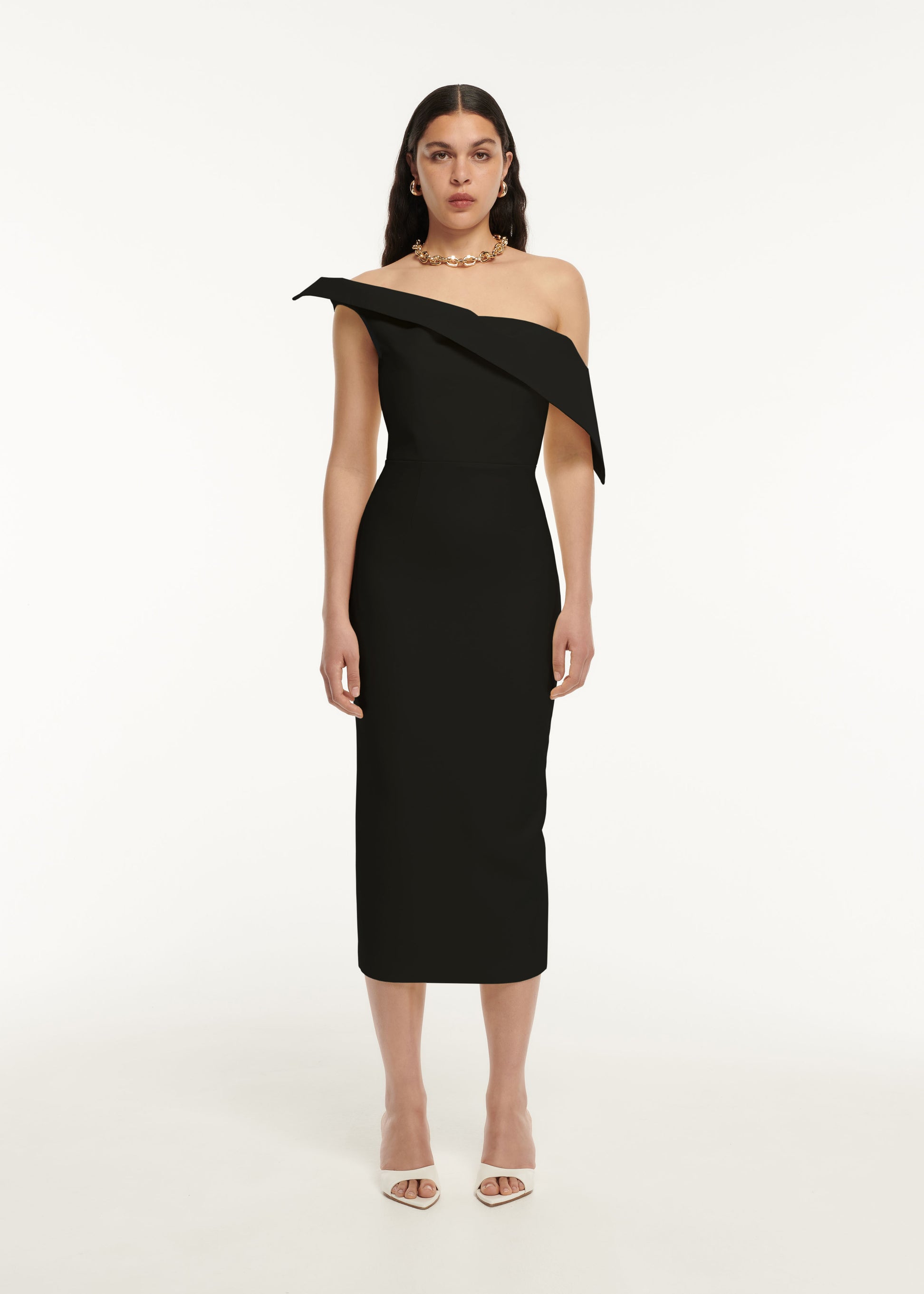 A woman wearing the Asymmetric Drape Wool Silk Midi Dress