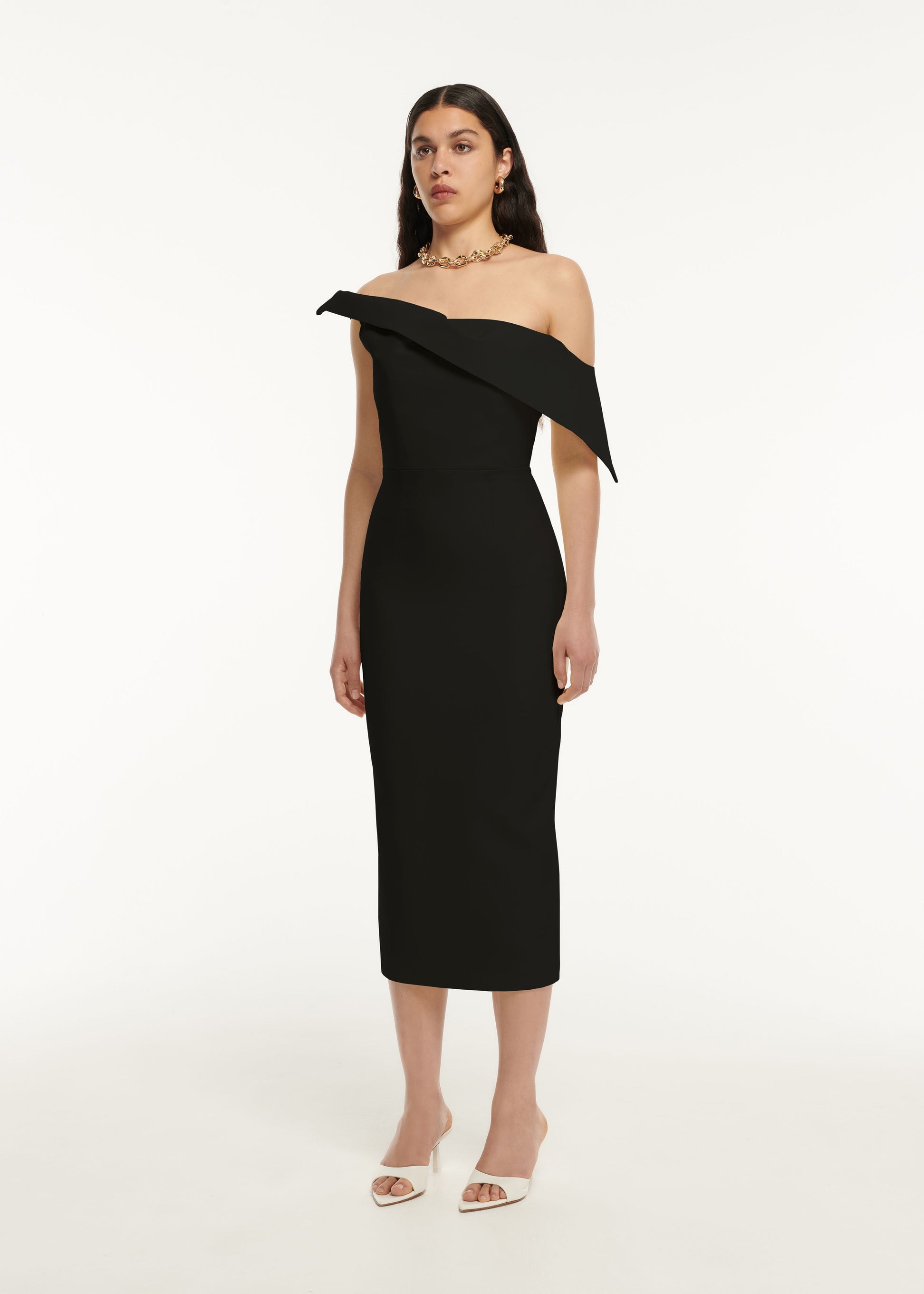 A woman wearing the Asymmetric Drape Wool Silk Midi Dress