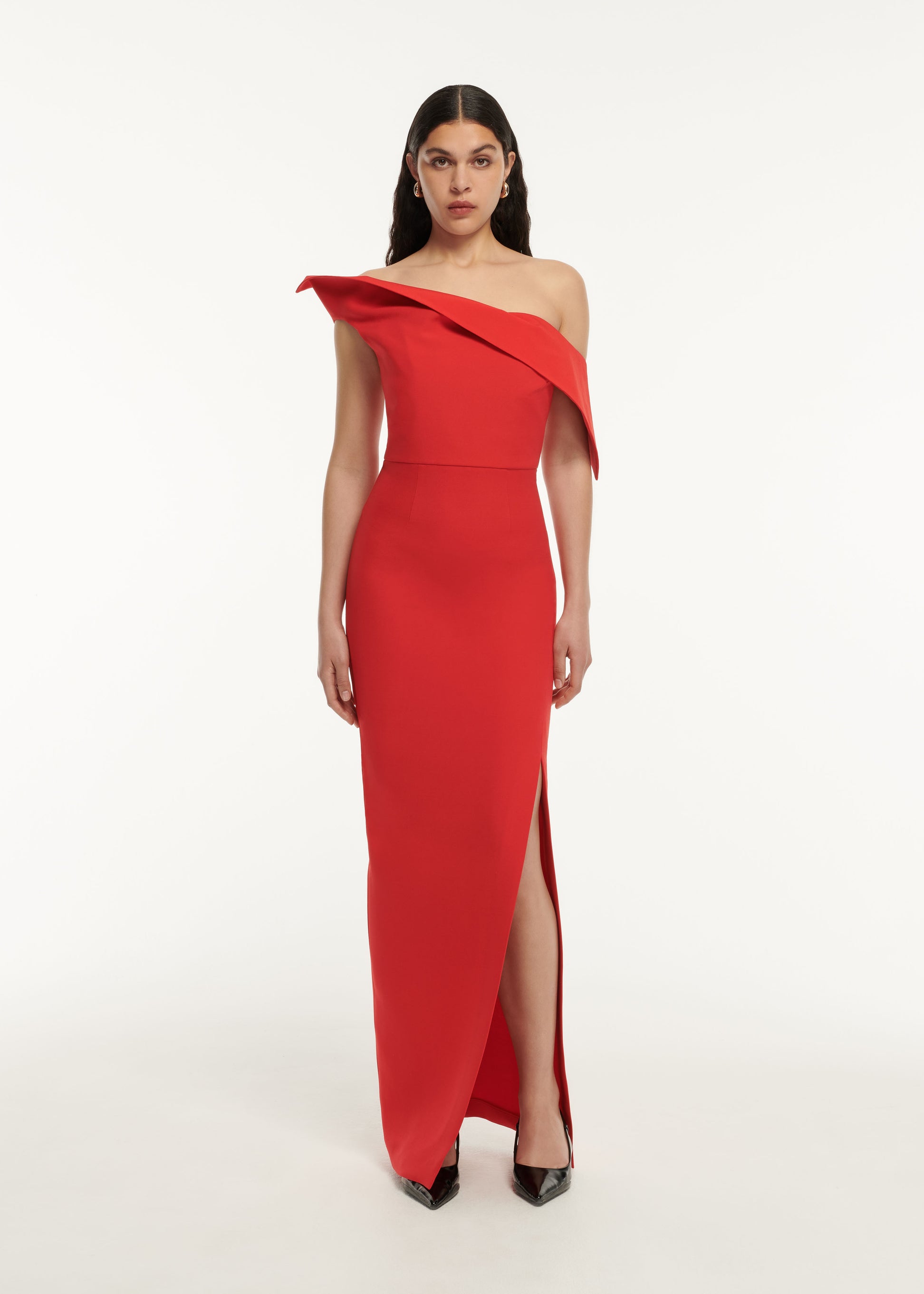 A woman wearing the Asymmetric Drape Wool Silk Maxi Dress