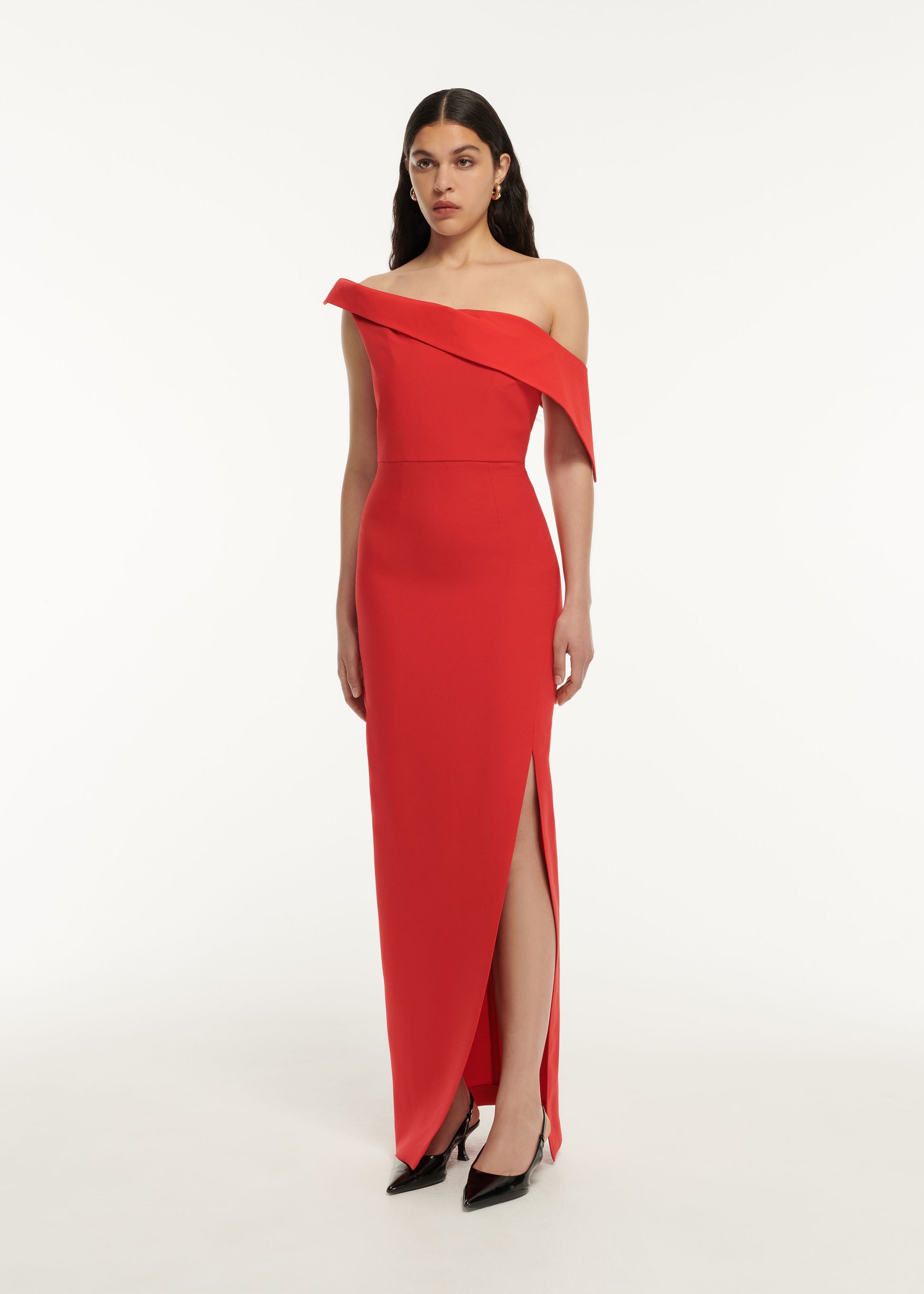 A woman wearing the Asymmetric Drape Wool Silk Maxi Dress