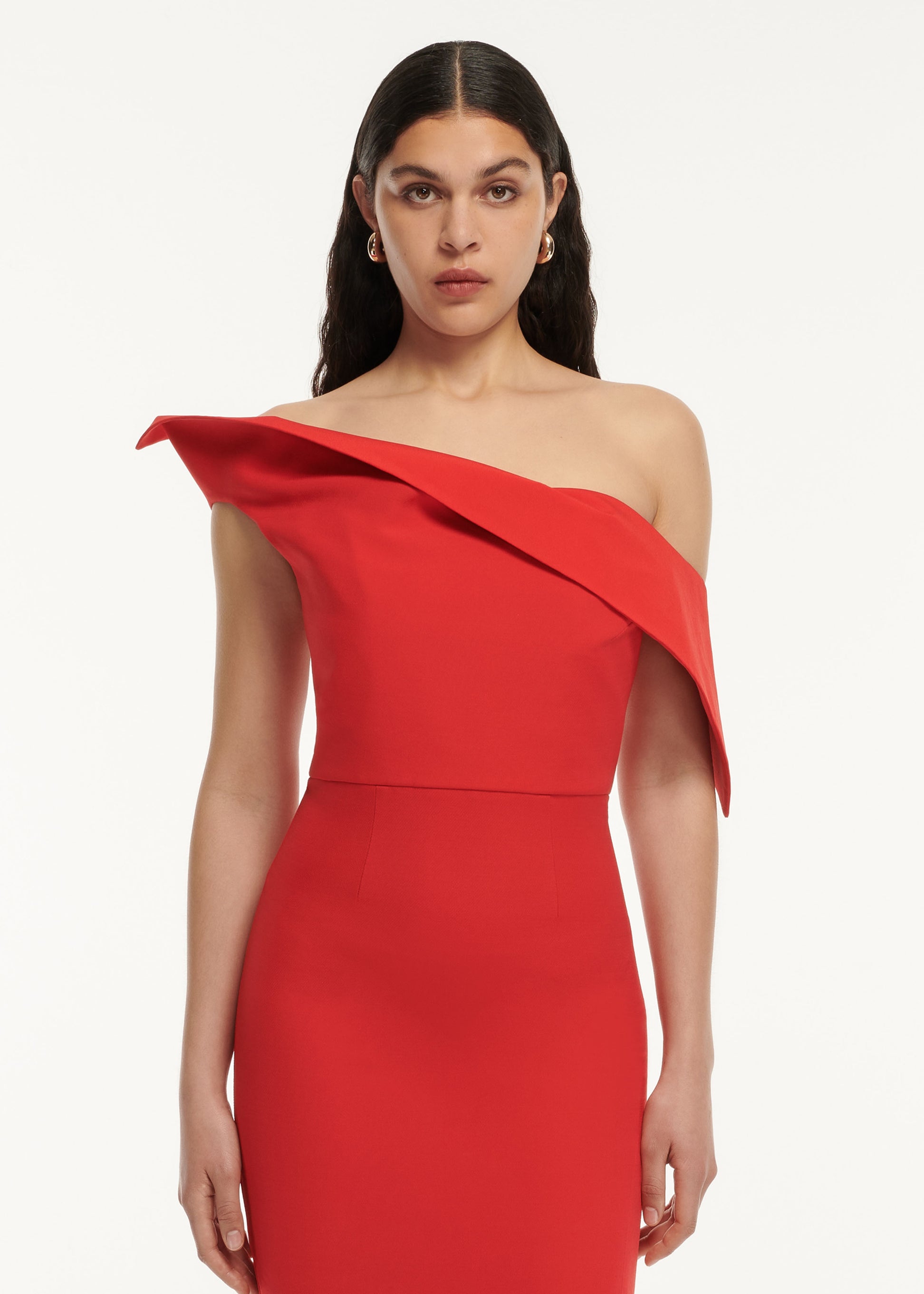 A close up of a woman wearing the Asymmetric Drape Wool Silk Maxi Dress