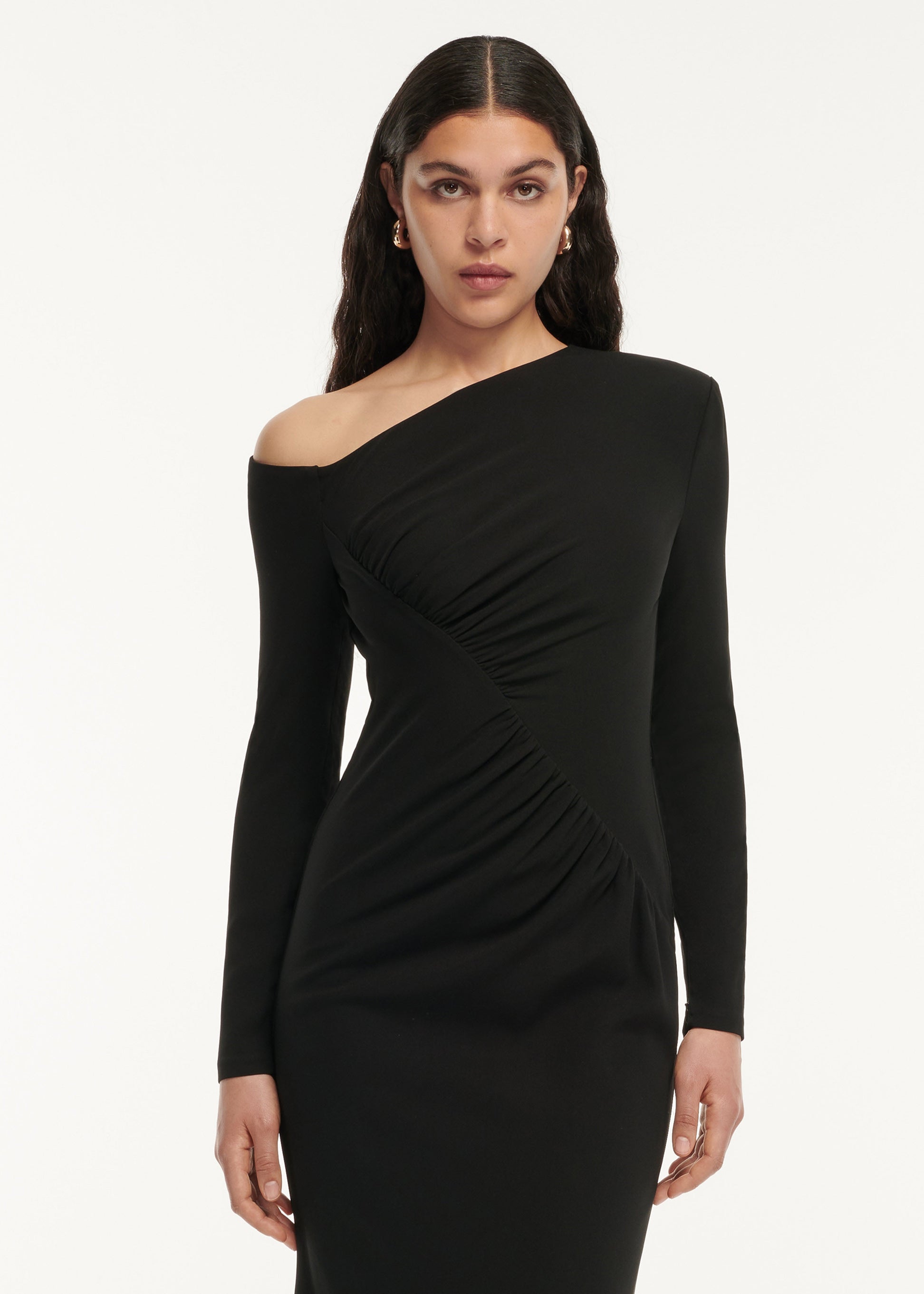 A close up of a woman wearing the Long Sleeve Stretch Cady Drape Maxi Dress