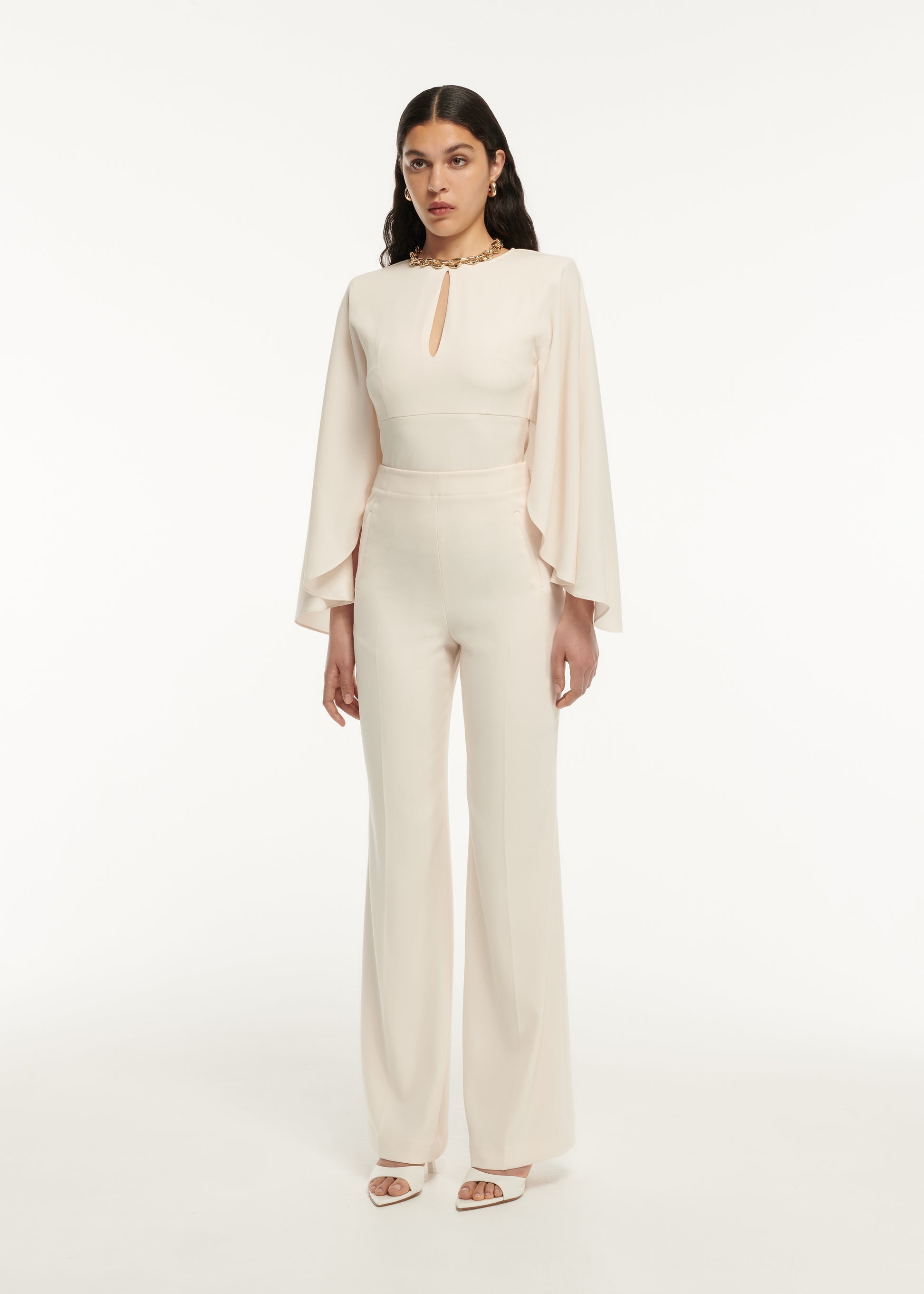 A woman wearing the Long Sleeve Satin Crepe Top