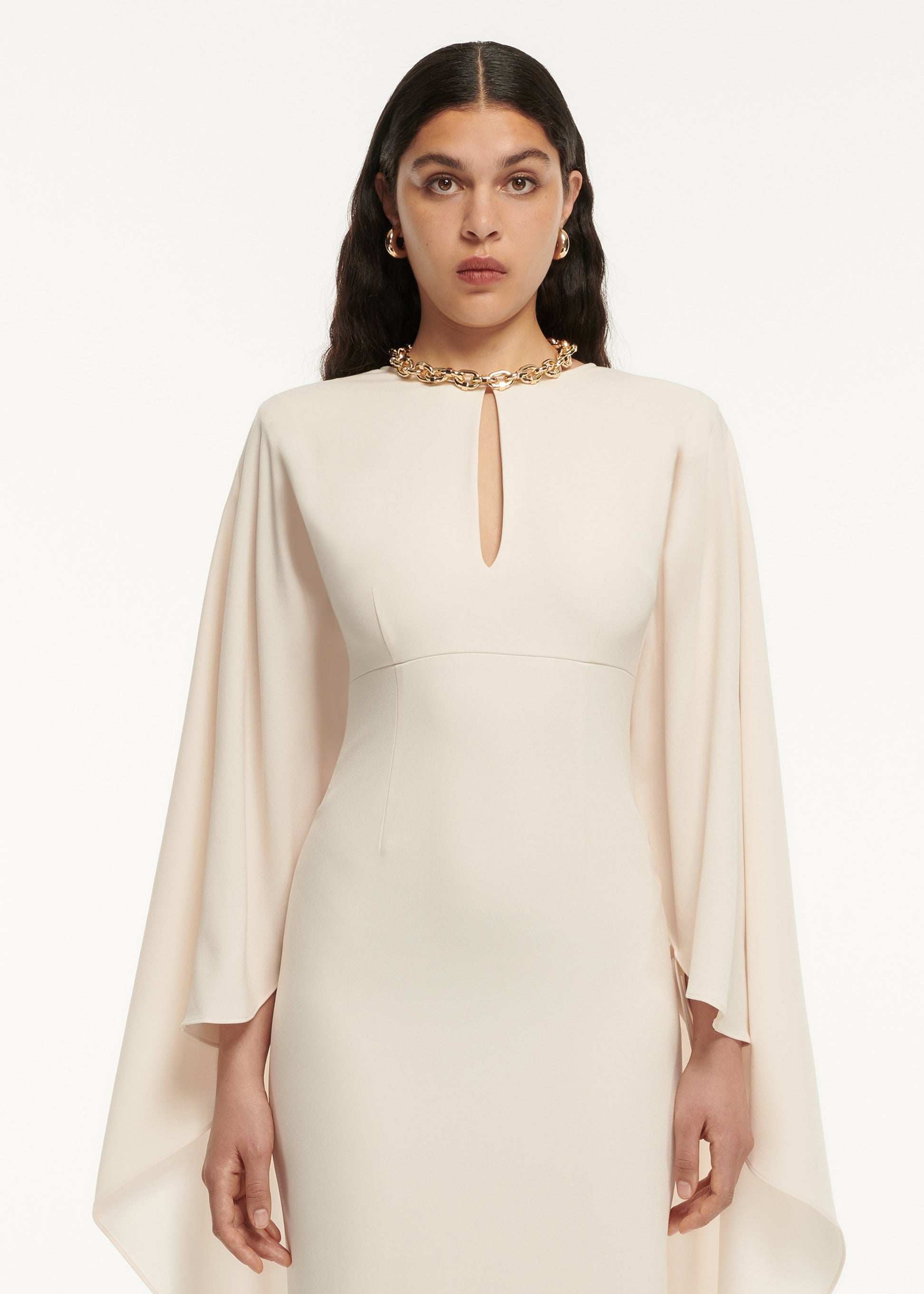 A close up of a woman wearing the Cape Satin Crepe Maxi Dress