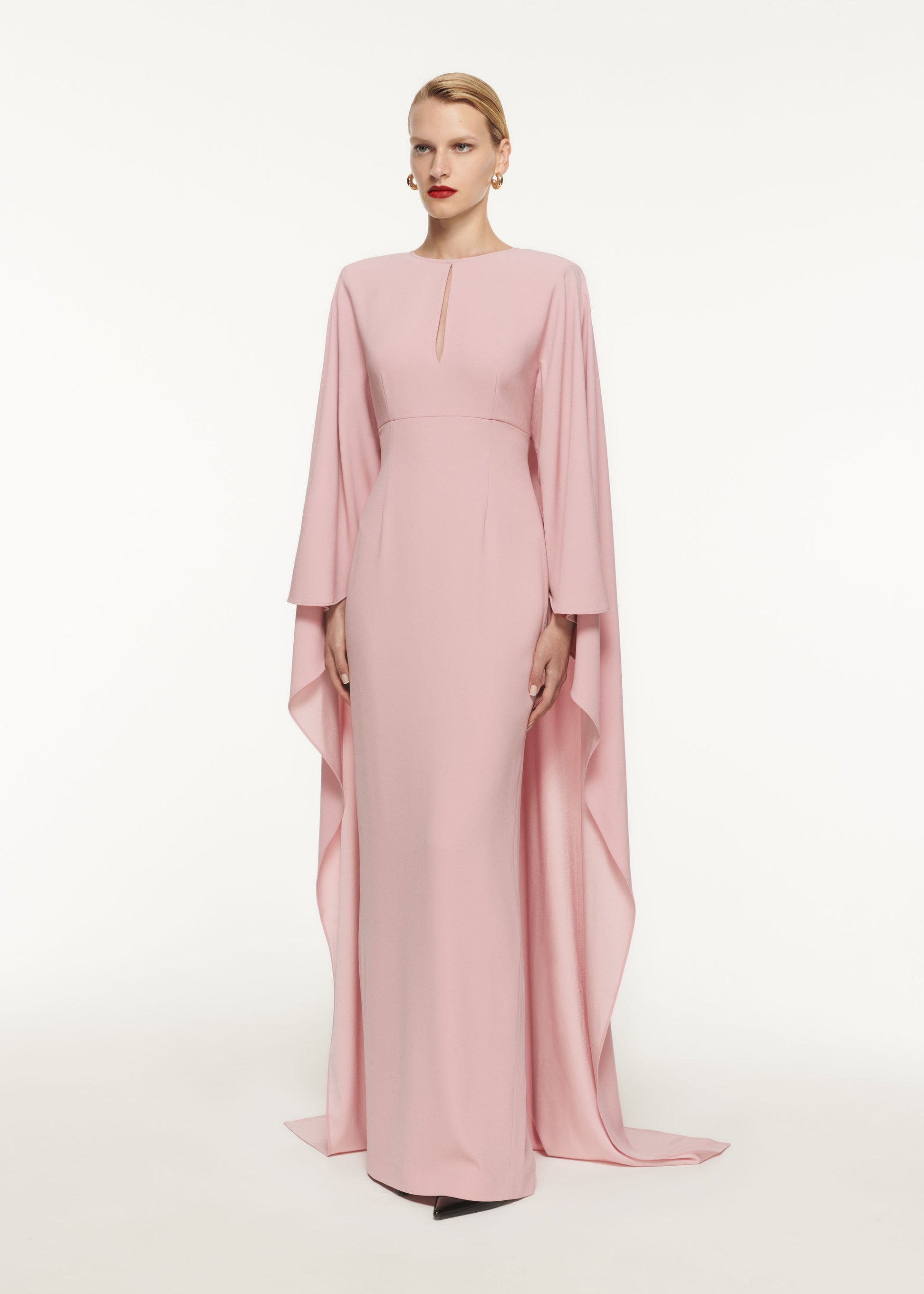 A woman wearing the Long Sleeve Satin Crepe Maxi Dress in Pink