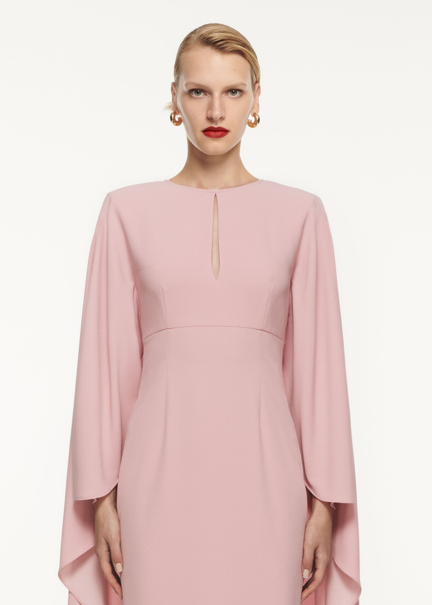 A close up of a woman wearing the Cape Satin Crepe Maxi Dress