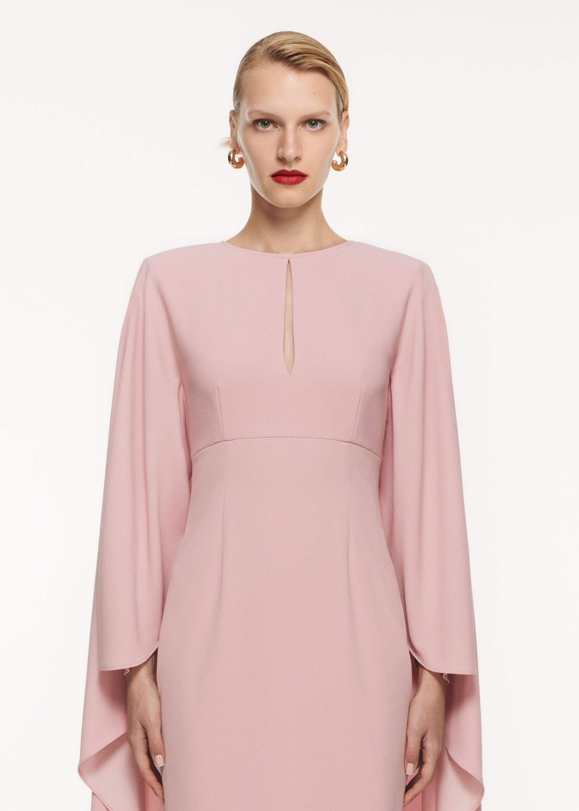 A close up of a woman wearing the Cape Satin Crepe Maxi Dress