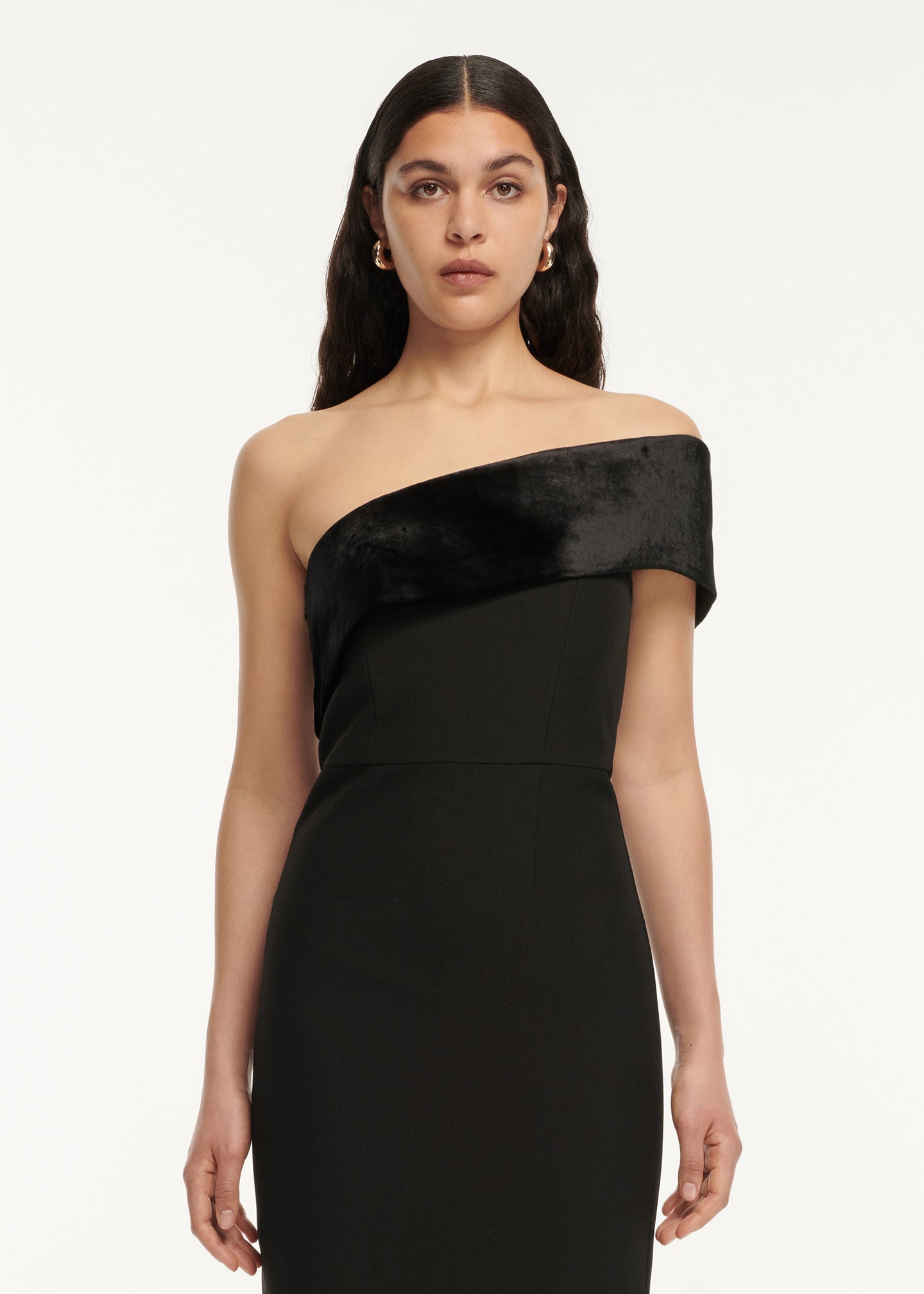 A close up of a woman wearing the Asymmetric Panelled Stretch Cady Midi Dress