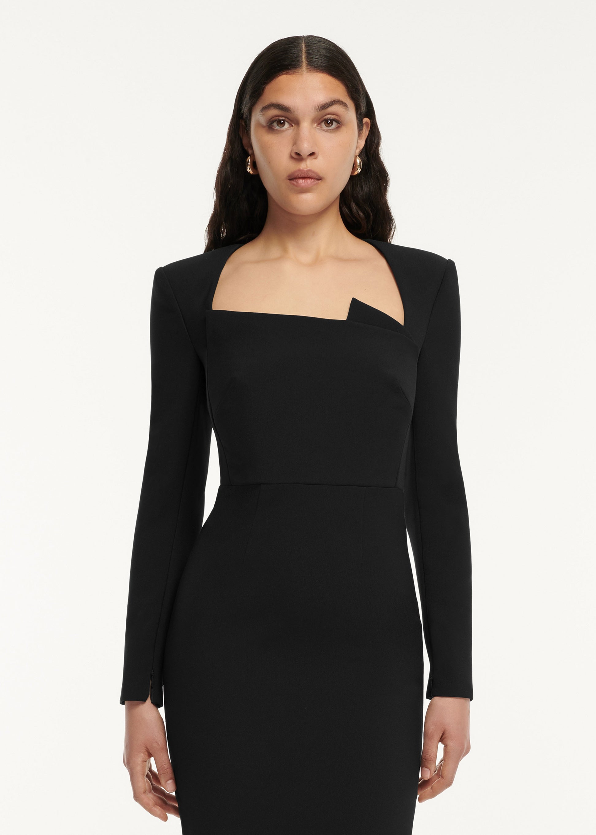 A close up of a woman wearing the Long Sleeve Crepe Midi Dress