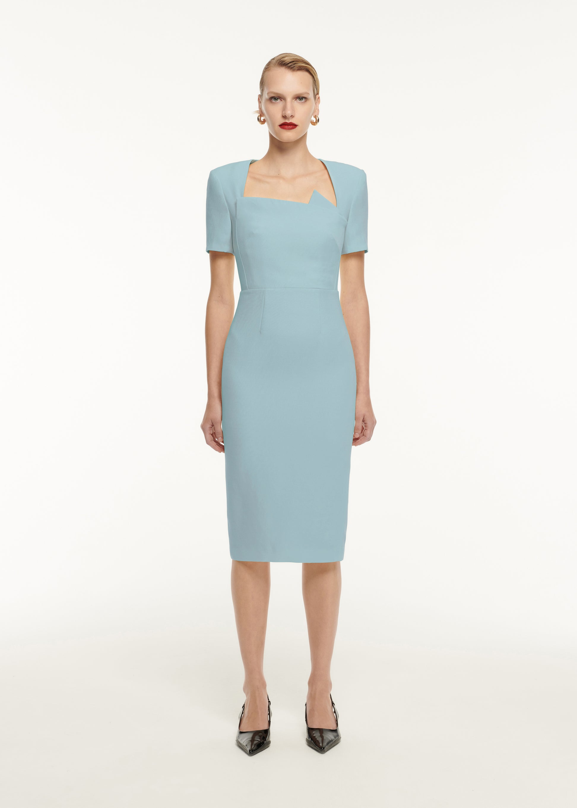 A woman wearing the Short Sleeve Pleat Detail Wool Silk Midi Dress