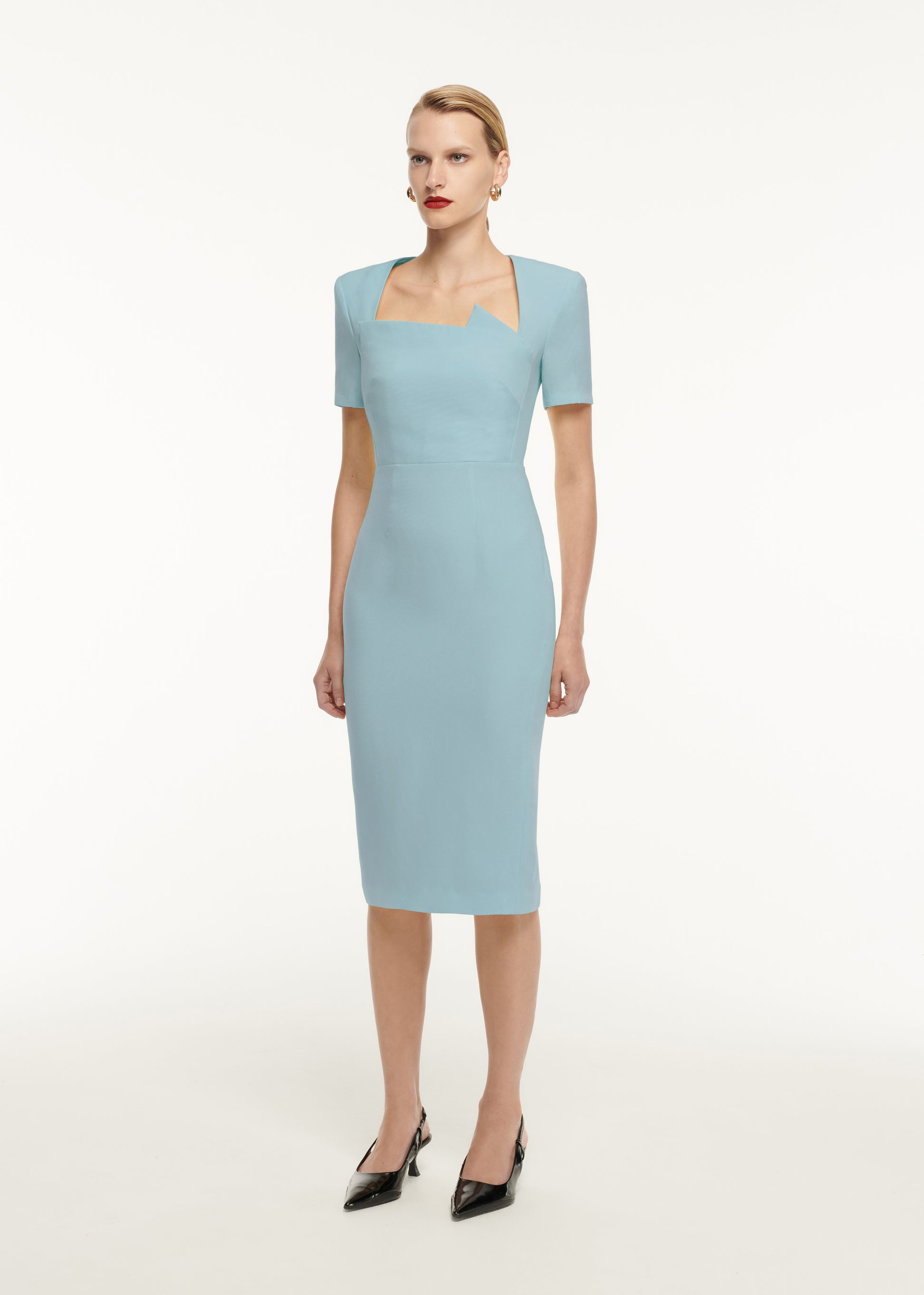 A woman wearing the Short Sleeve Pleat Detail Wool Silk Midi Dress