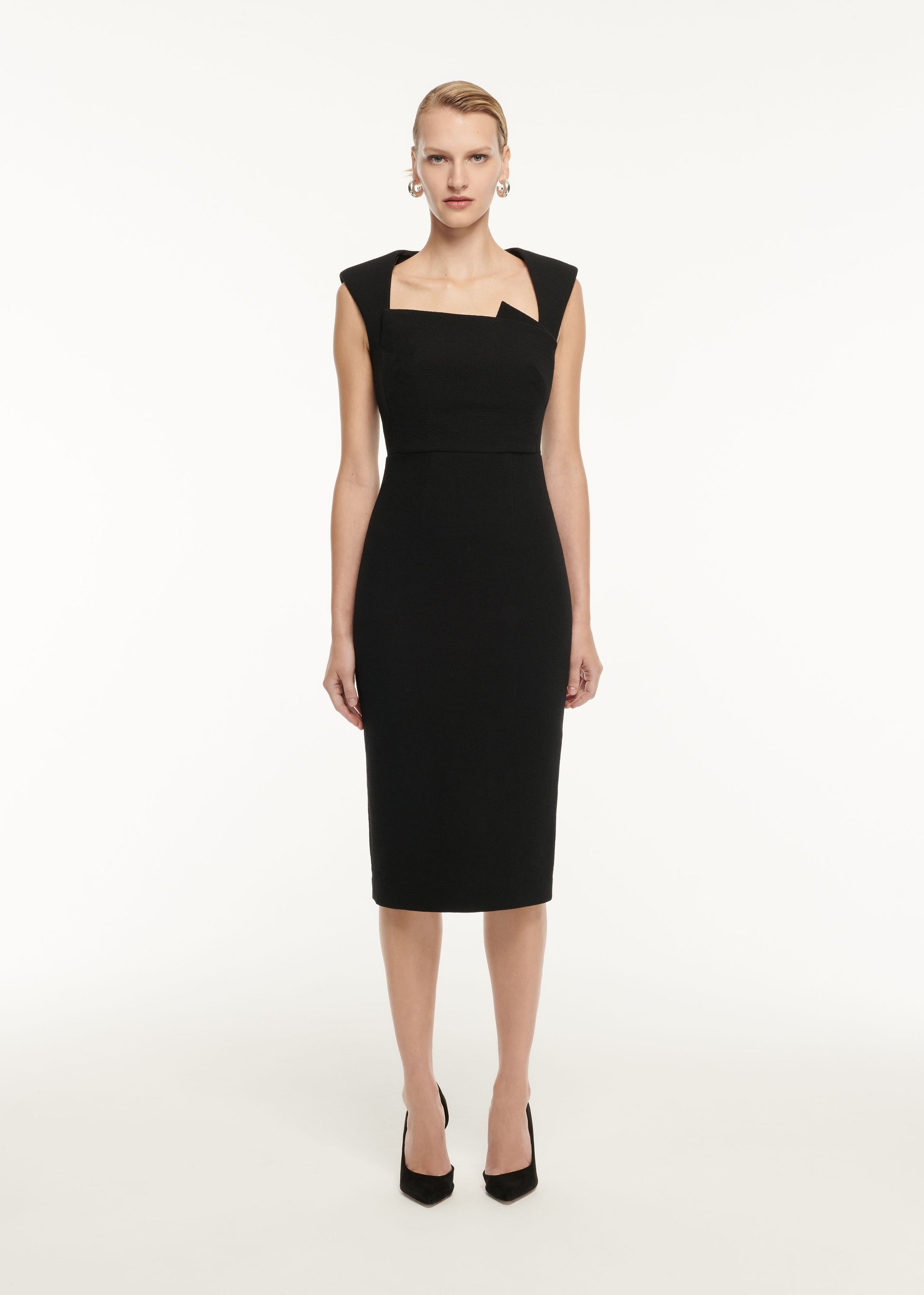 A woman wearing the Wool Crepe Midi Dress in Black