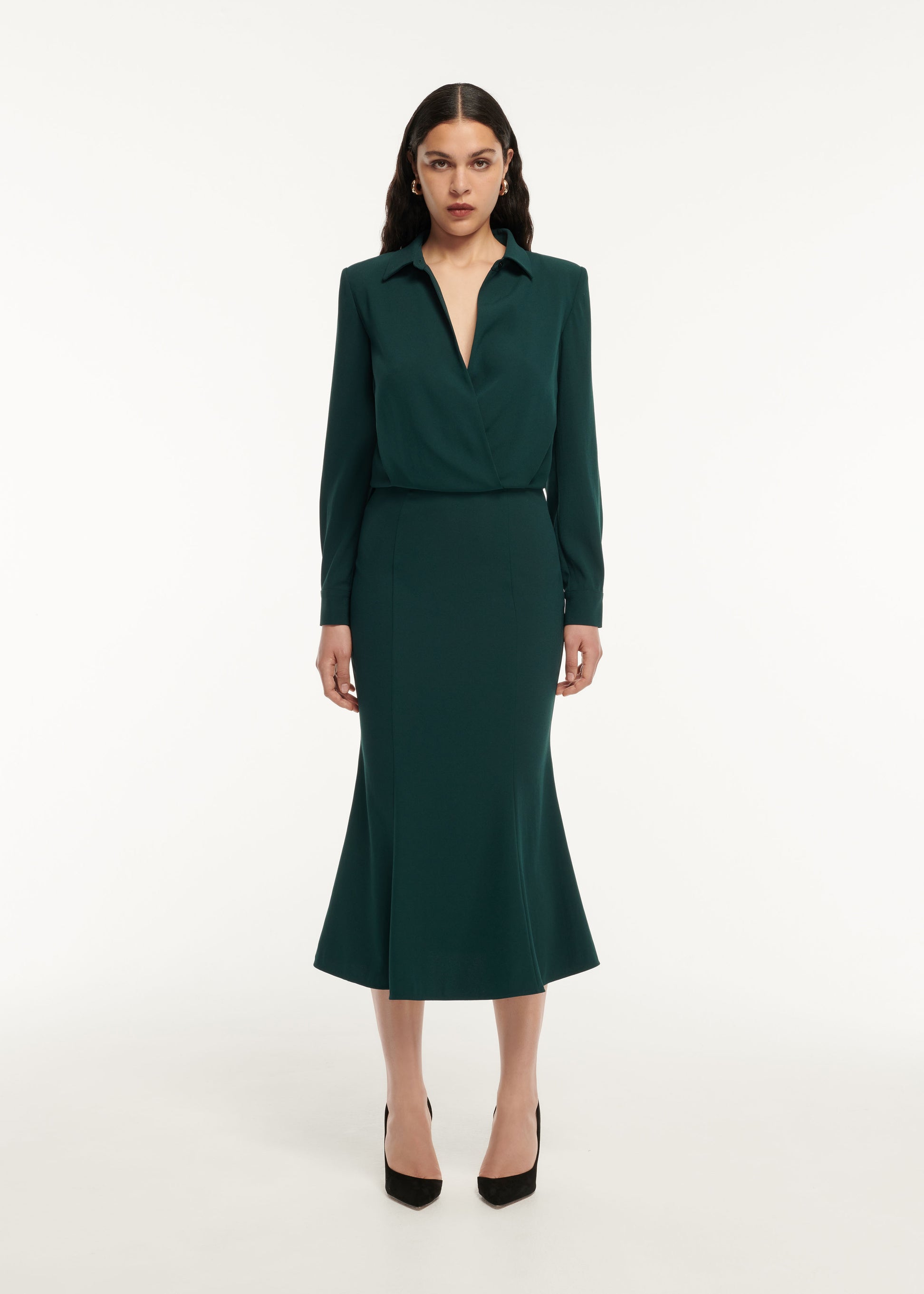 A woman wearing the Long Sleeve Collar Satin Crepe Midi Dress in Green