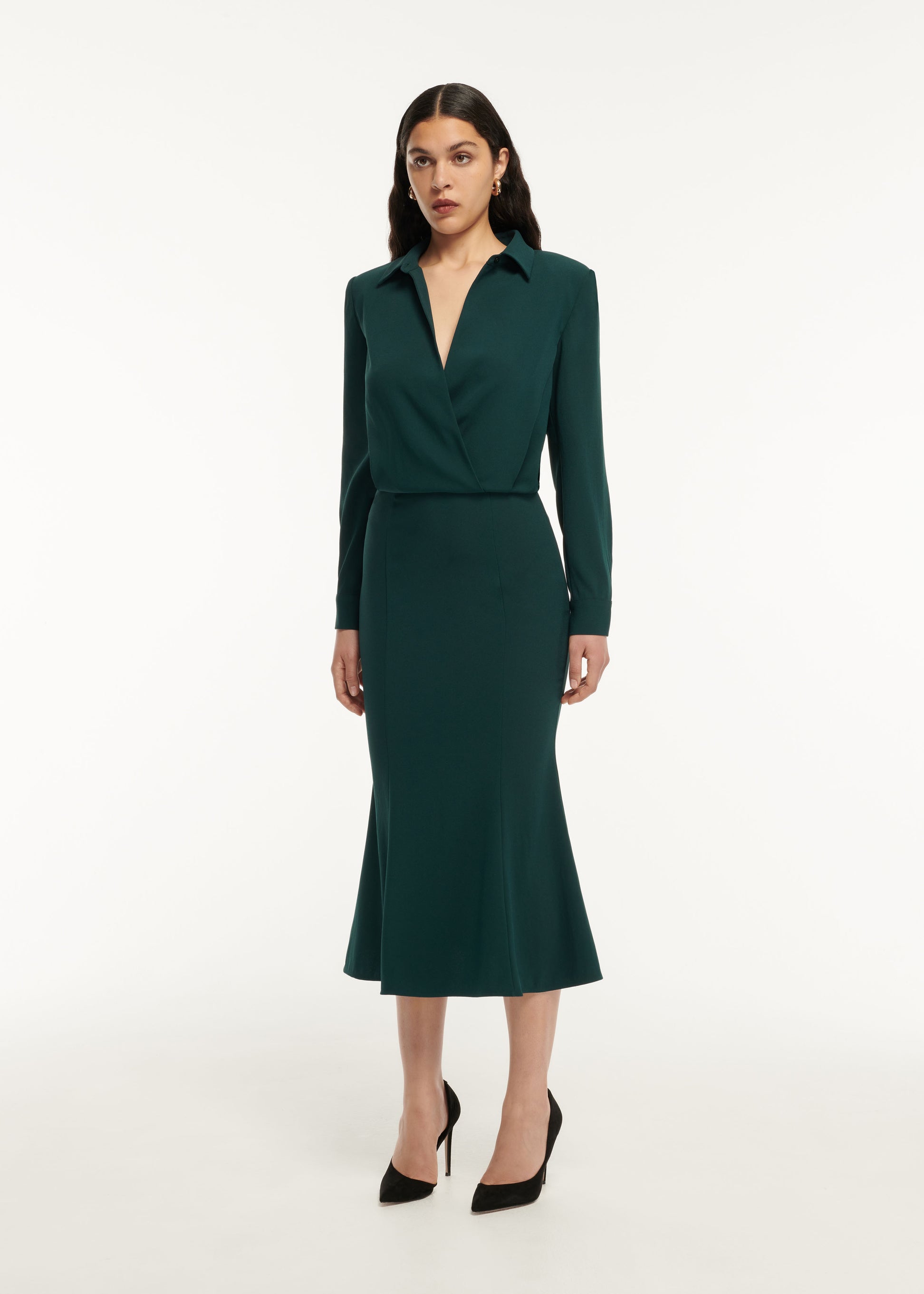 A woman wearing the Long Sleeve Collar Satin Crepe Midi Dress in Green