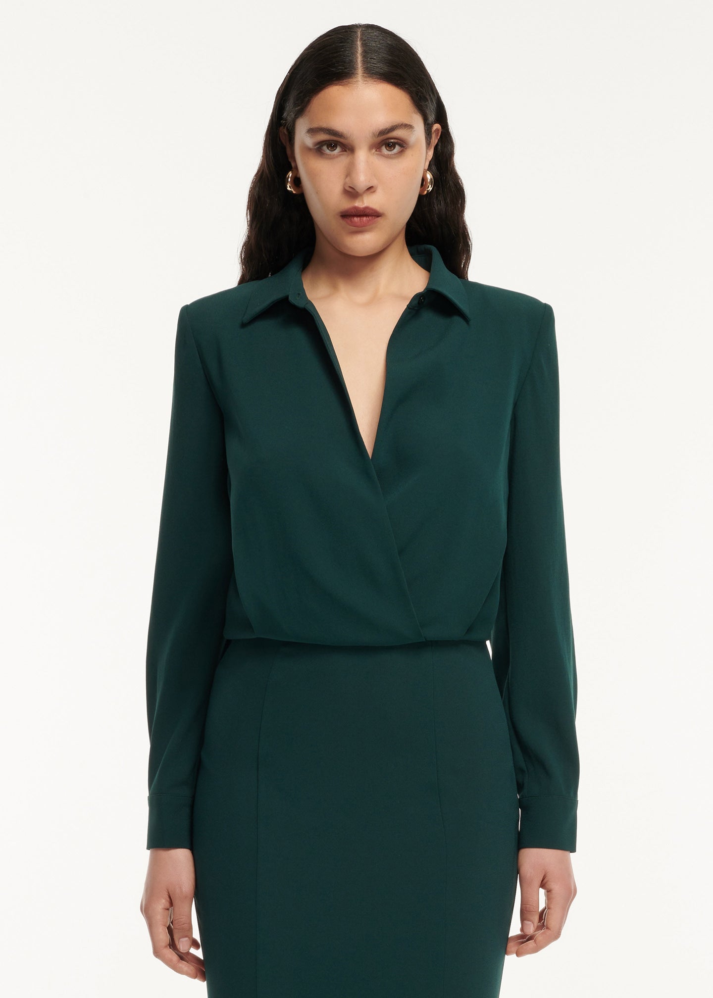 A close up of a woman wearing the Long Sleeve Collar Satin Crepe Midi Dress