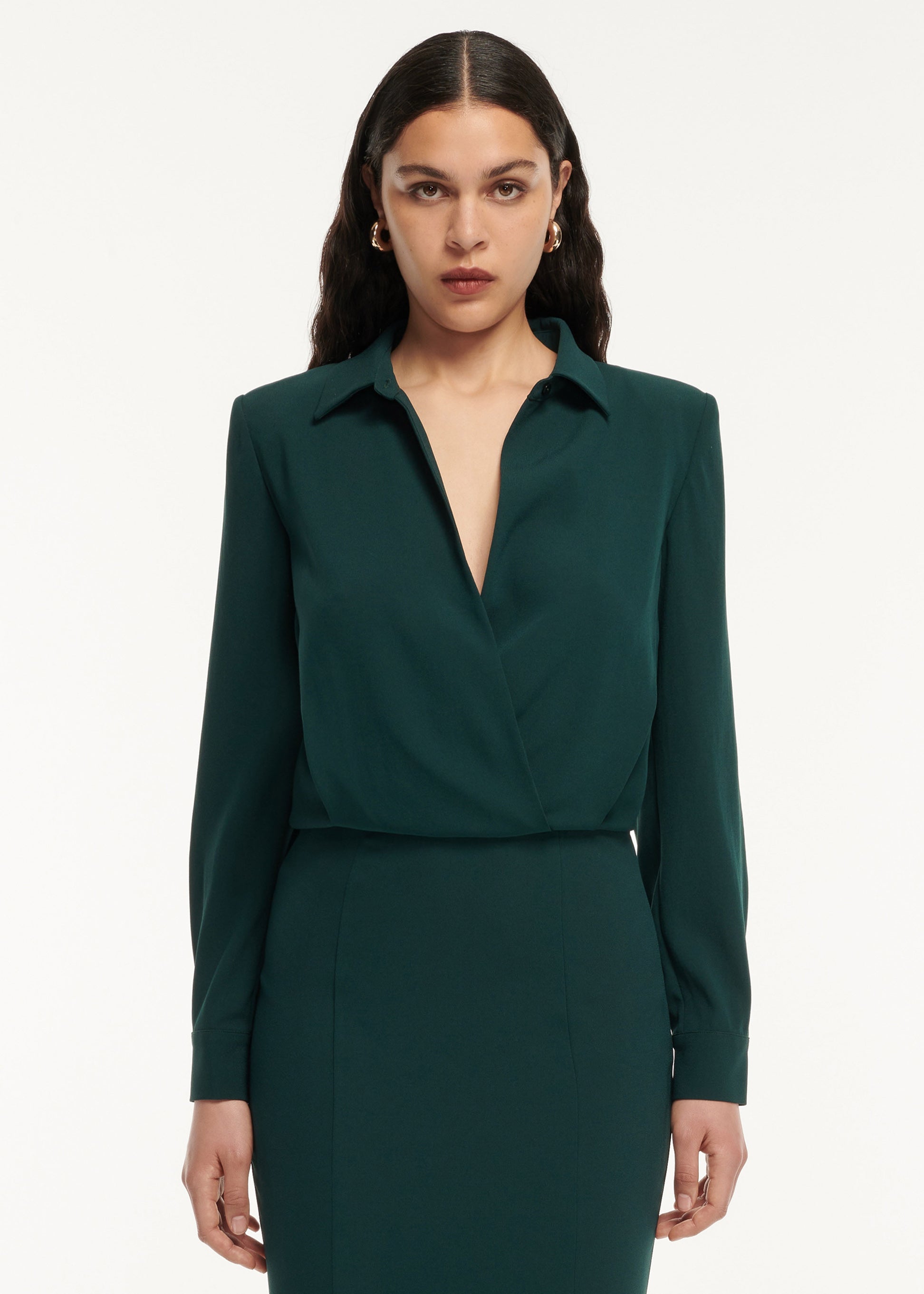 A close up of a woman wearing the Long Sleeve Collar Satin Crepe Midi Dress