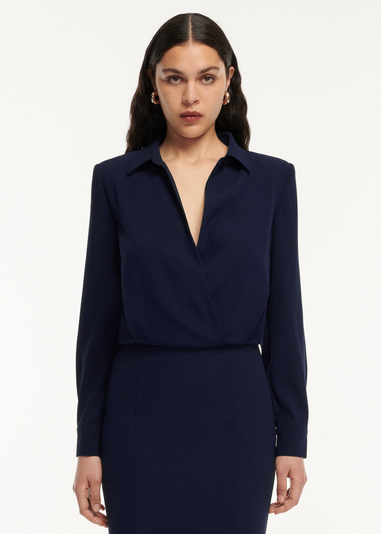 A close up of a woman wearing the Long Sleeve Collar Satin Crepe Midi Dress