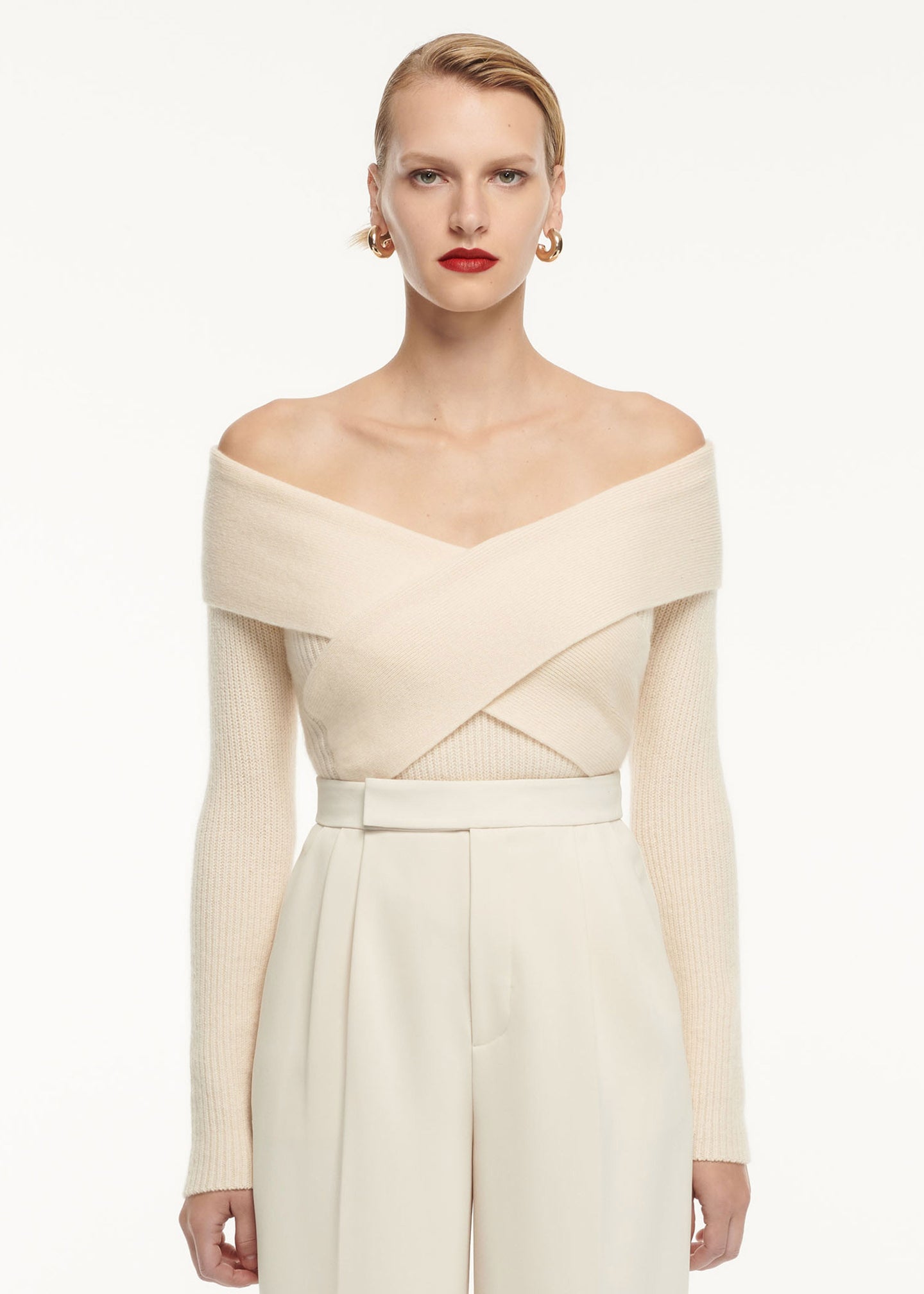 A close up of a woman wearing the Wide Leg Stretch Cady Trouser Cream