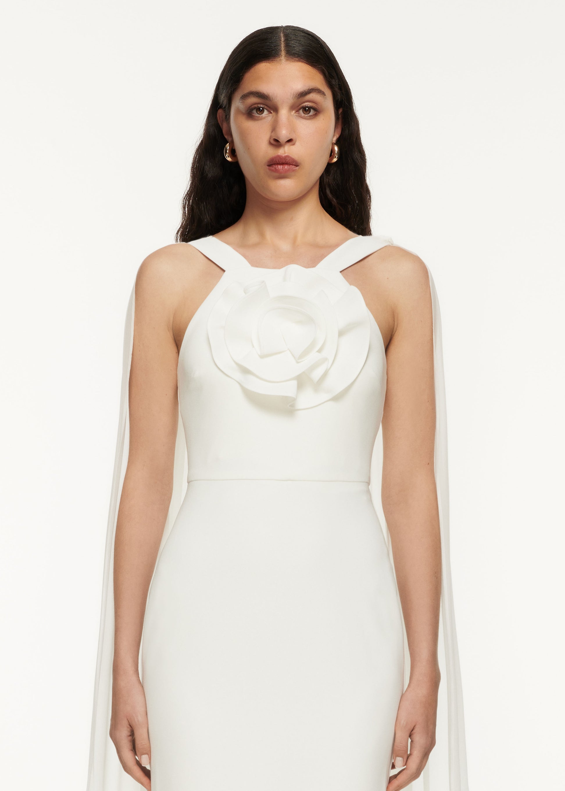 A close up of a woman wearing the Stretch Cady Gown White