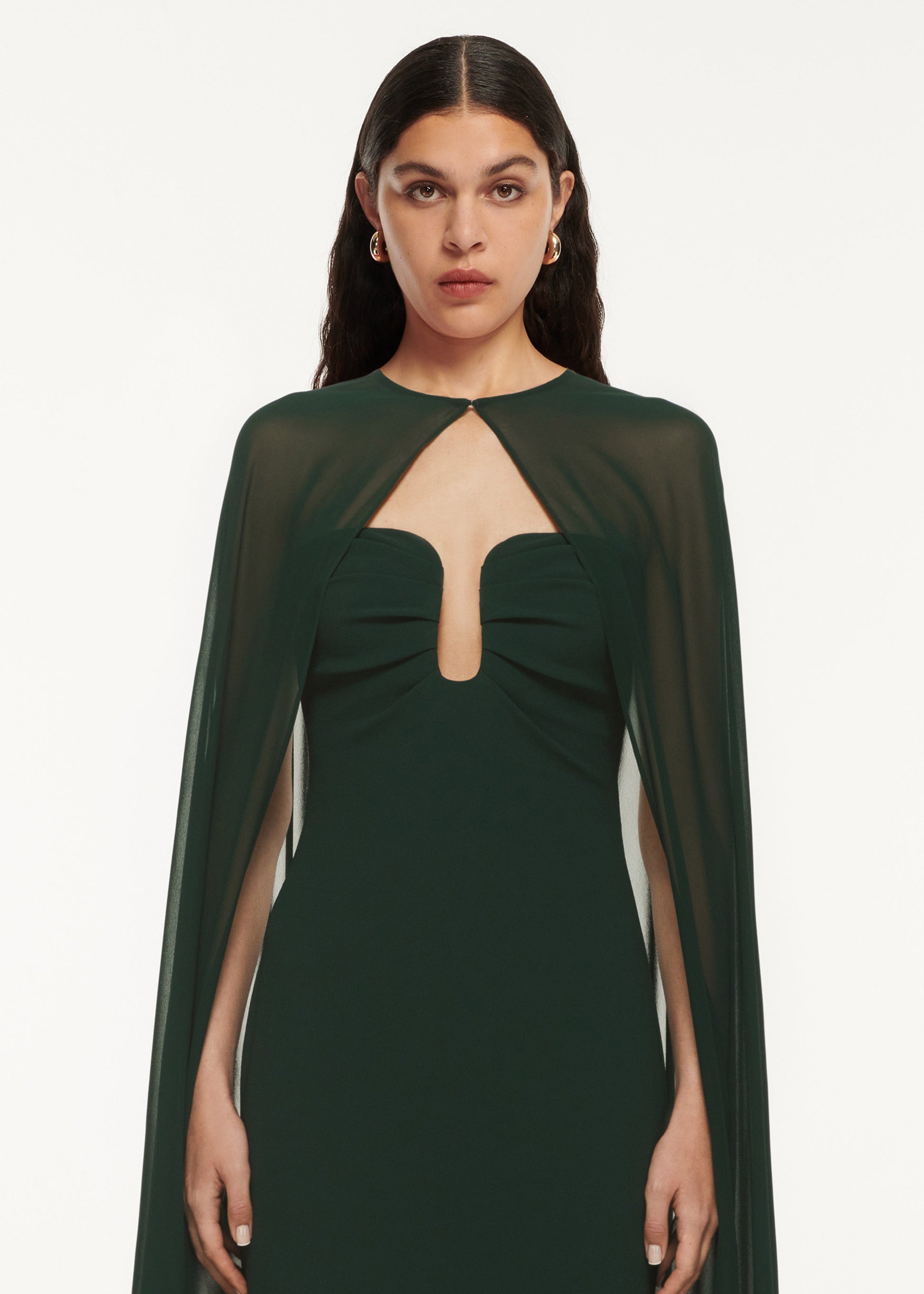 A close up of a woman wearing the Strapless Satin Crepe Gown Green