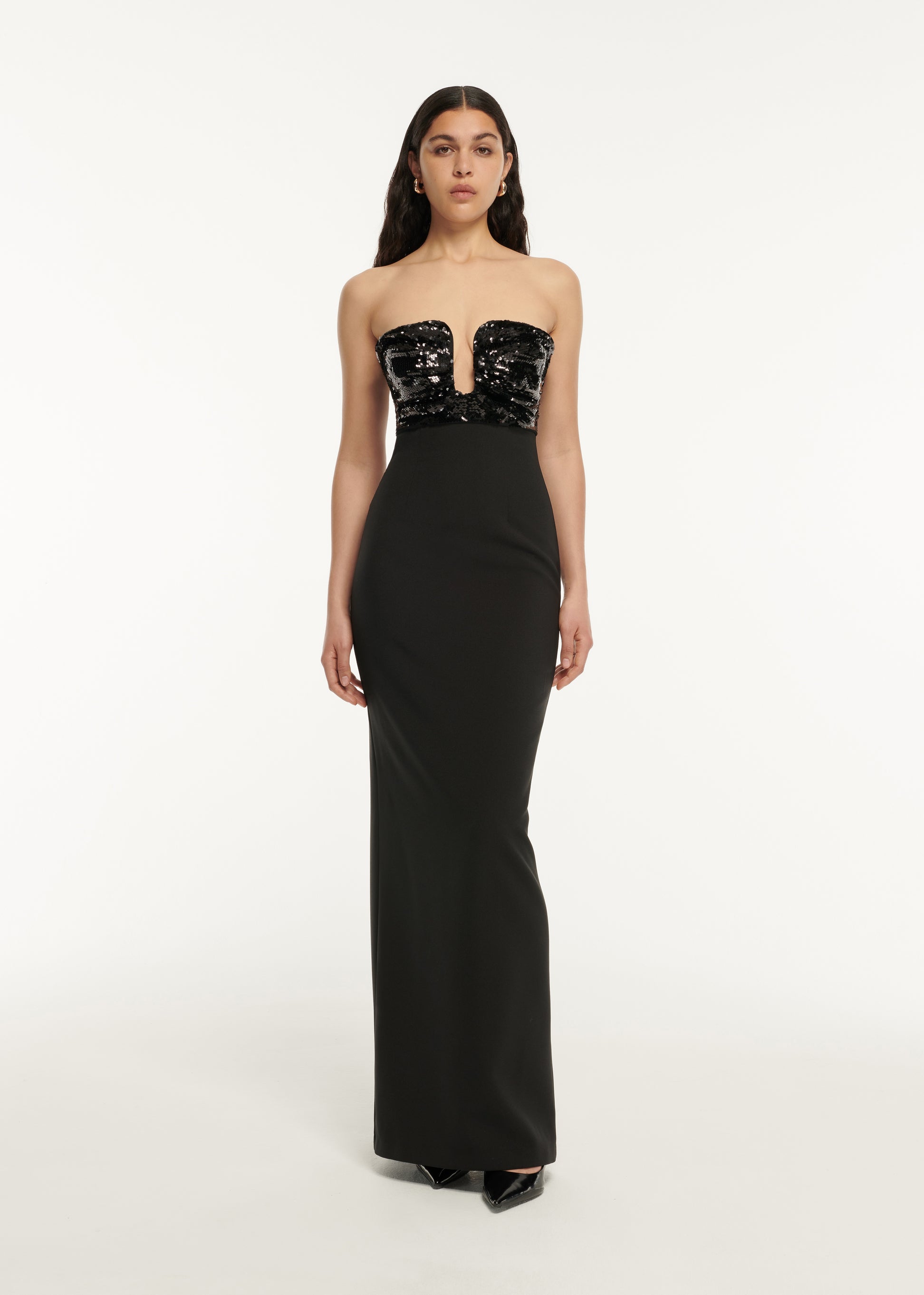 A woman wearing the Strapless Embellished Maxi Dress