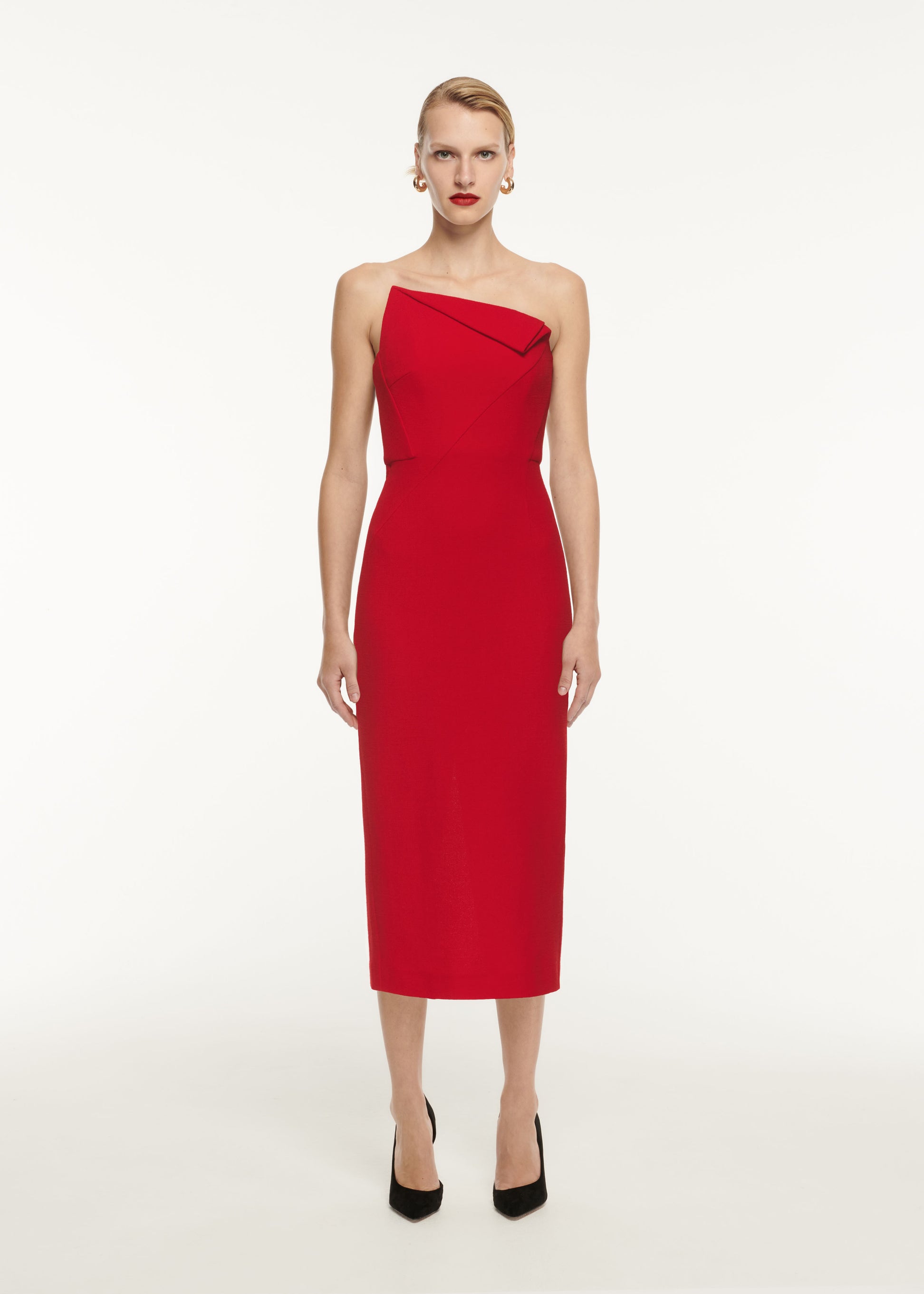 A woman wearing the Asymmetric Wool Crepe Midi Dress