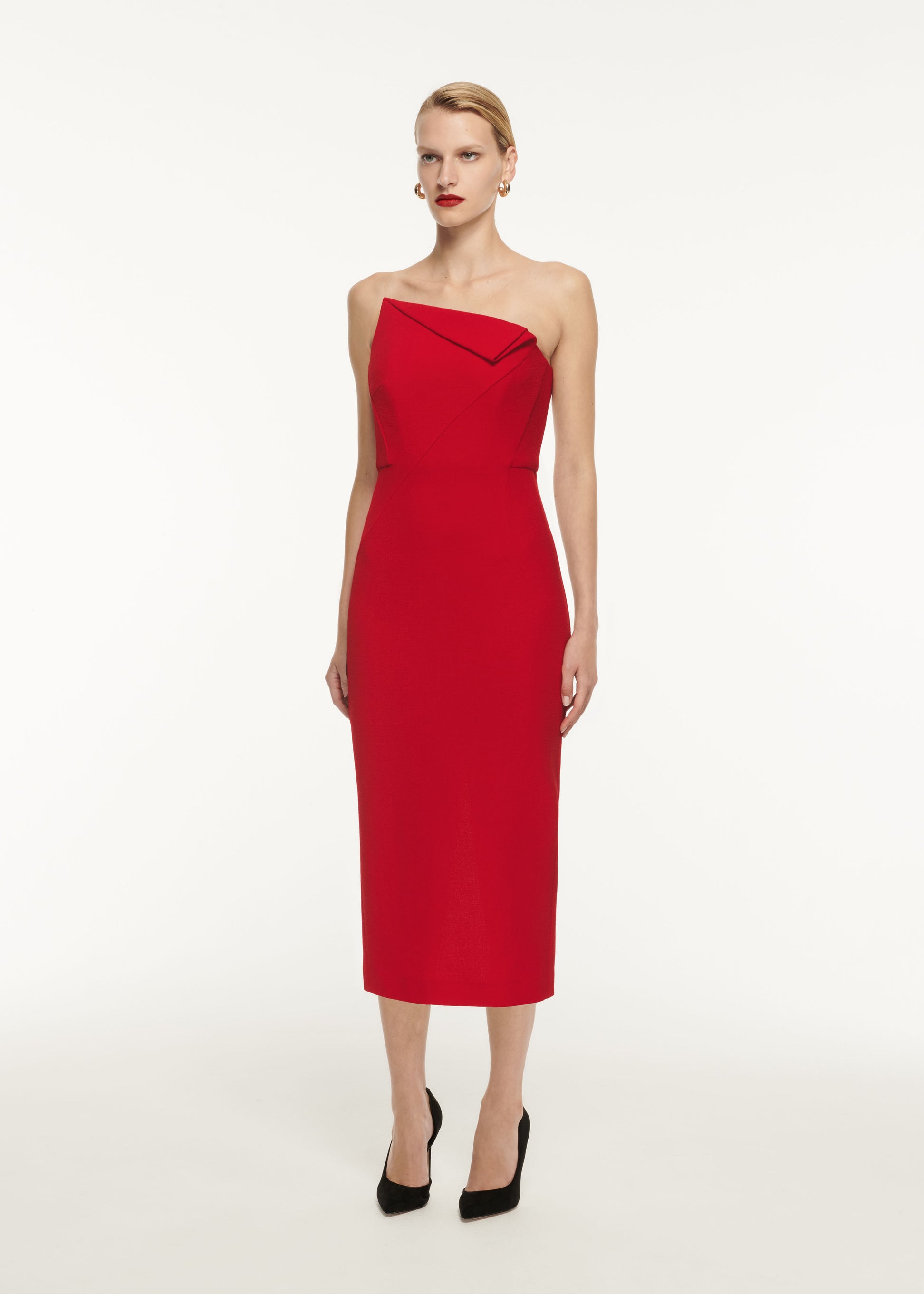 A woman wearing the Asymmetric Wool Crepe Midi Dress