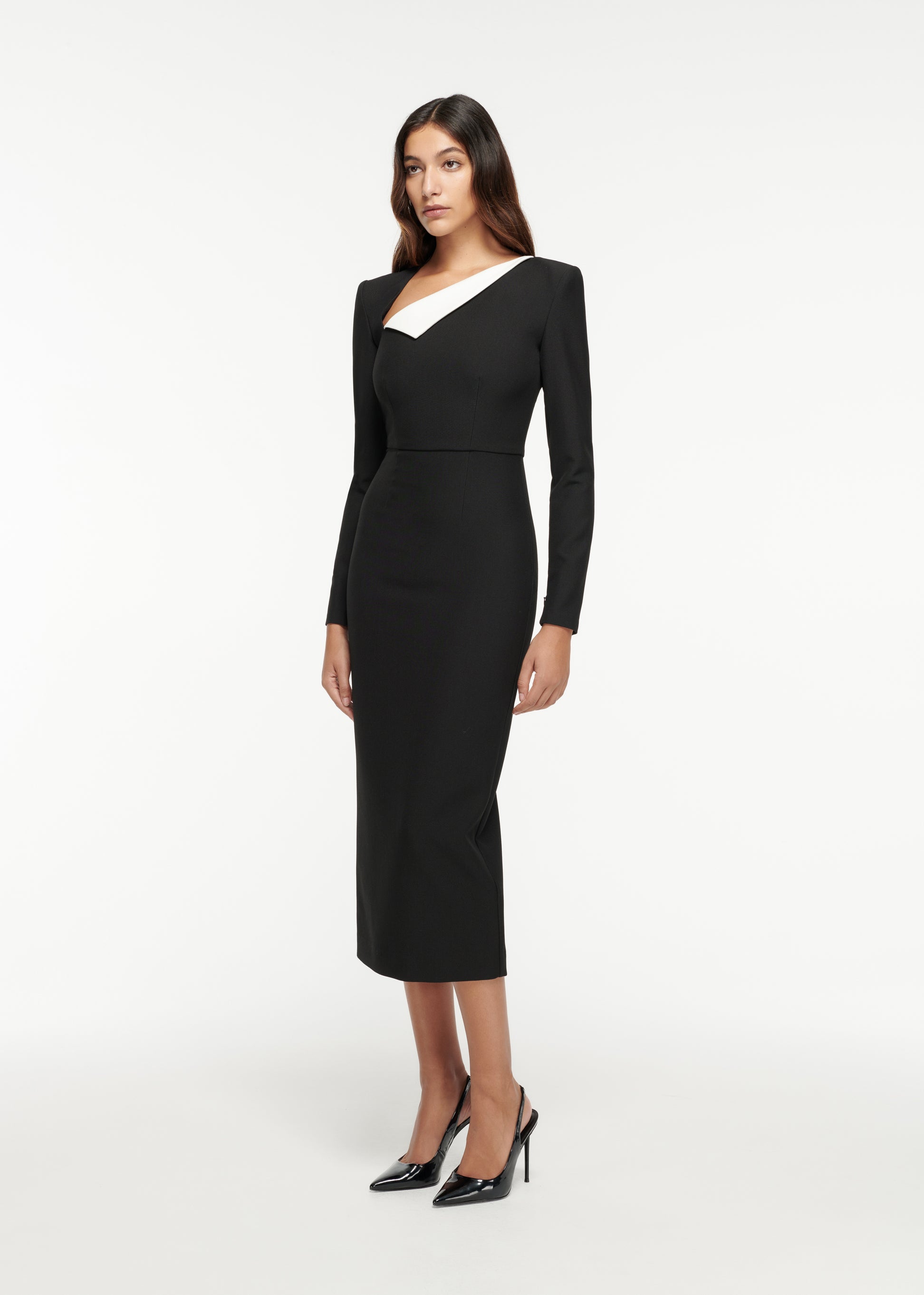 Side view of a model wearing the Long Sleeve Crepe Midi Dress in Monochrome