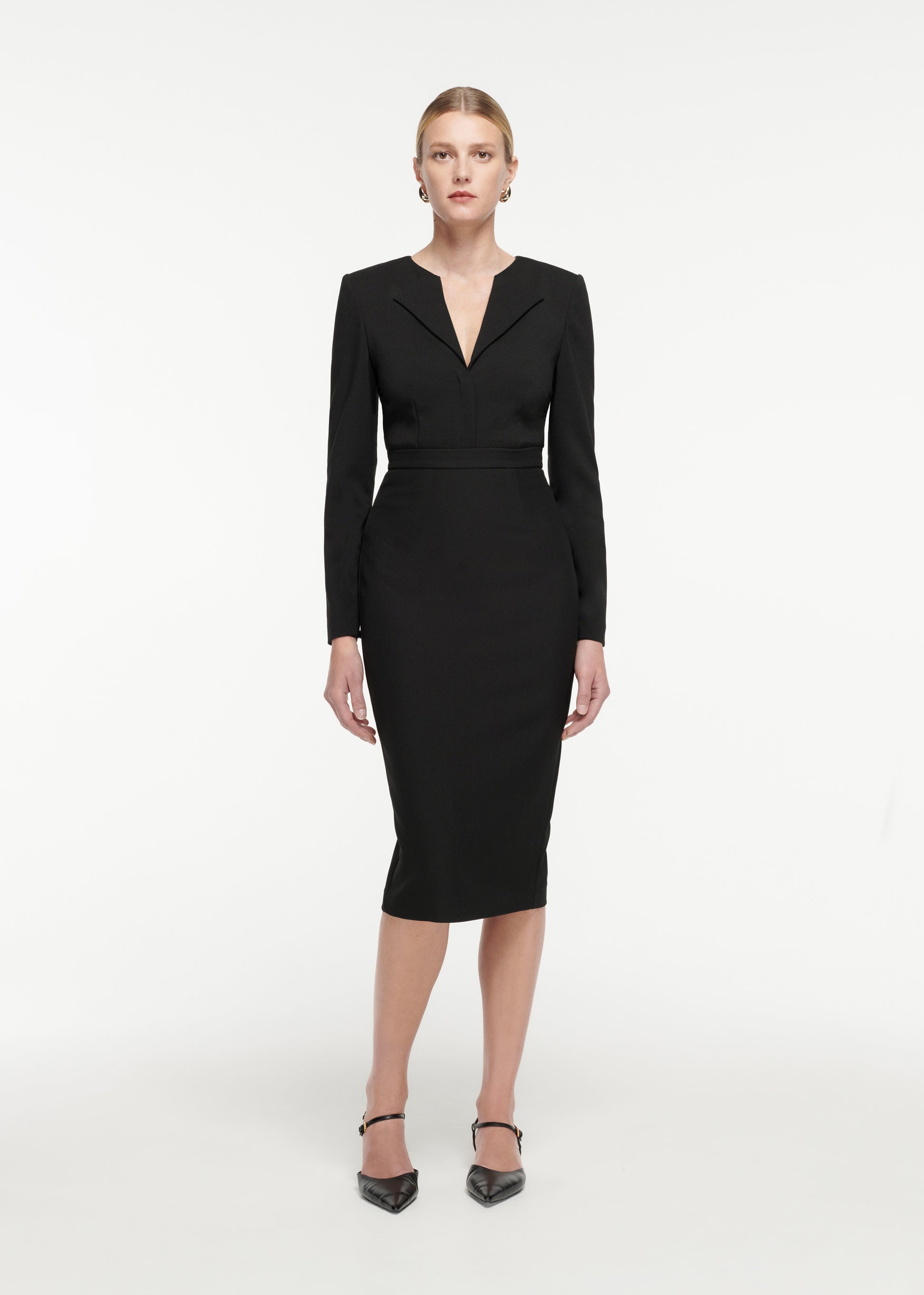 Front view of a model wearing the Crepe Midi Skirt in Black