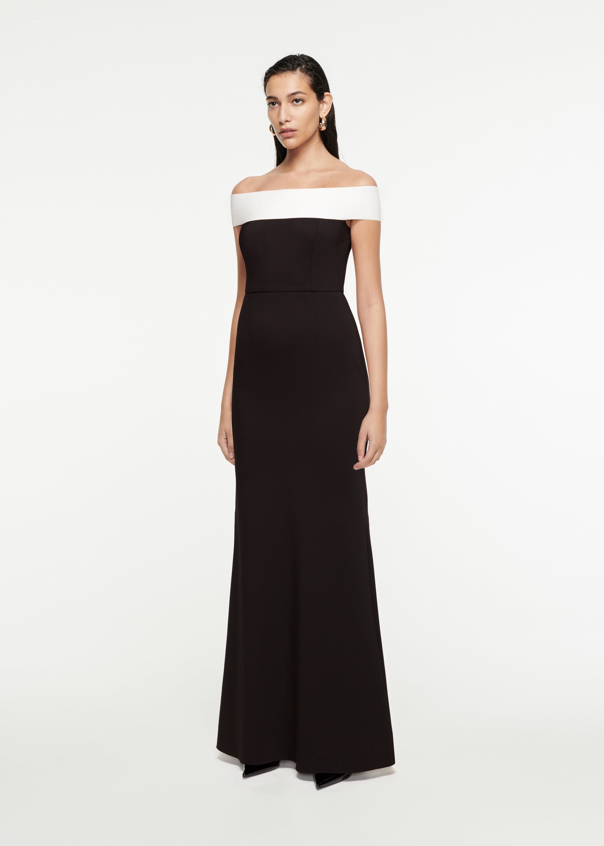 Woman wearing the Off-The-Shoulder Stretch-Cady Gown in Black